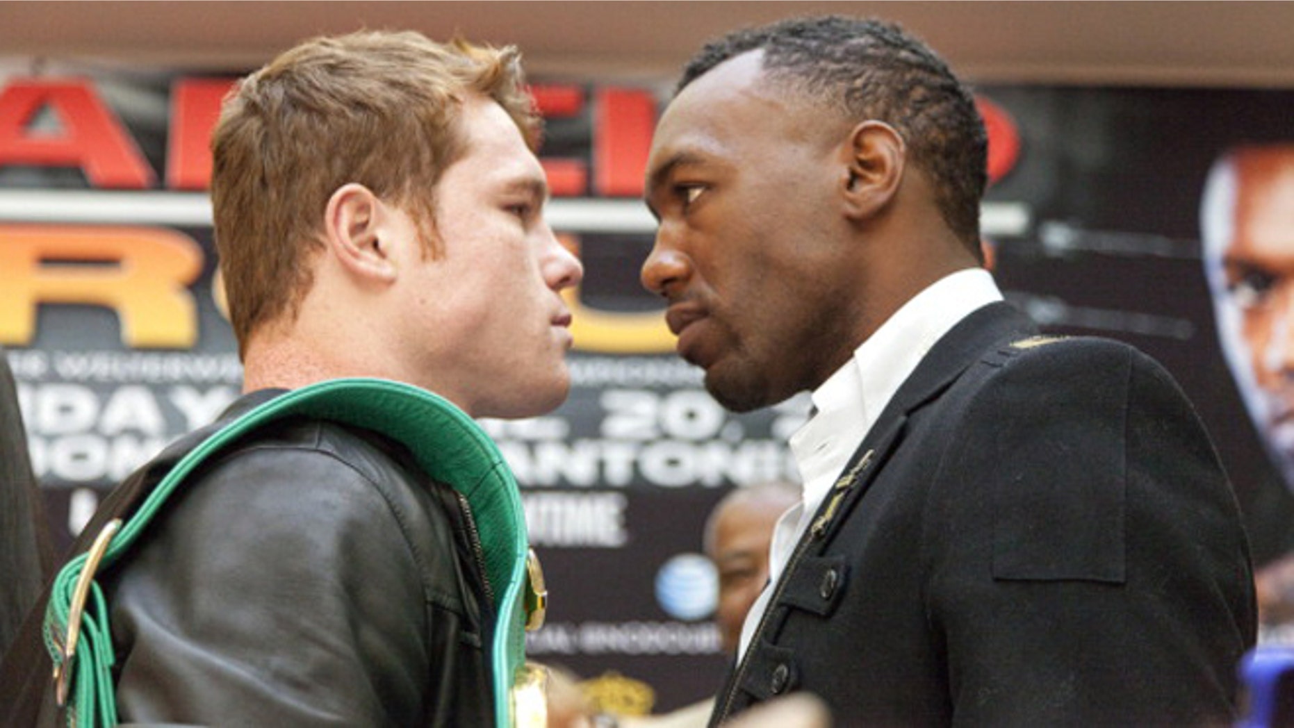 HOUSTON - MARCH 14: WBC Super Welterweight Champion Canelo Alvarez (L) and WBA Super Welterweight Champion Austin "No Doubt" Trout pose for photographers after a press conference on March 14, 2013 in Houston, Texas. Alvaez and Trout will unify the 154-pound division April 20, 2013 in San Antonio. (Photo by Bob Levey/Getty Images)