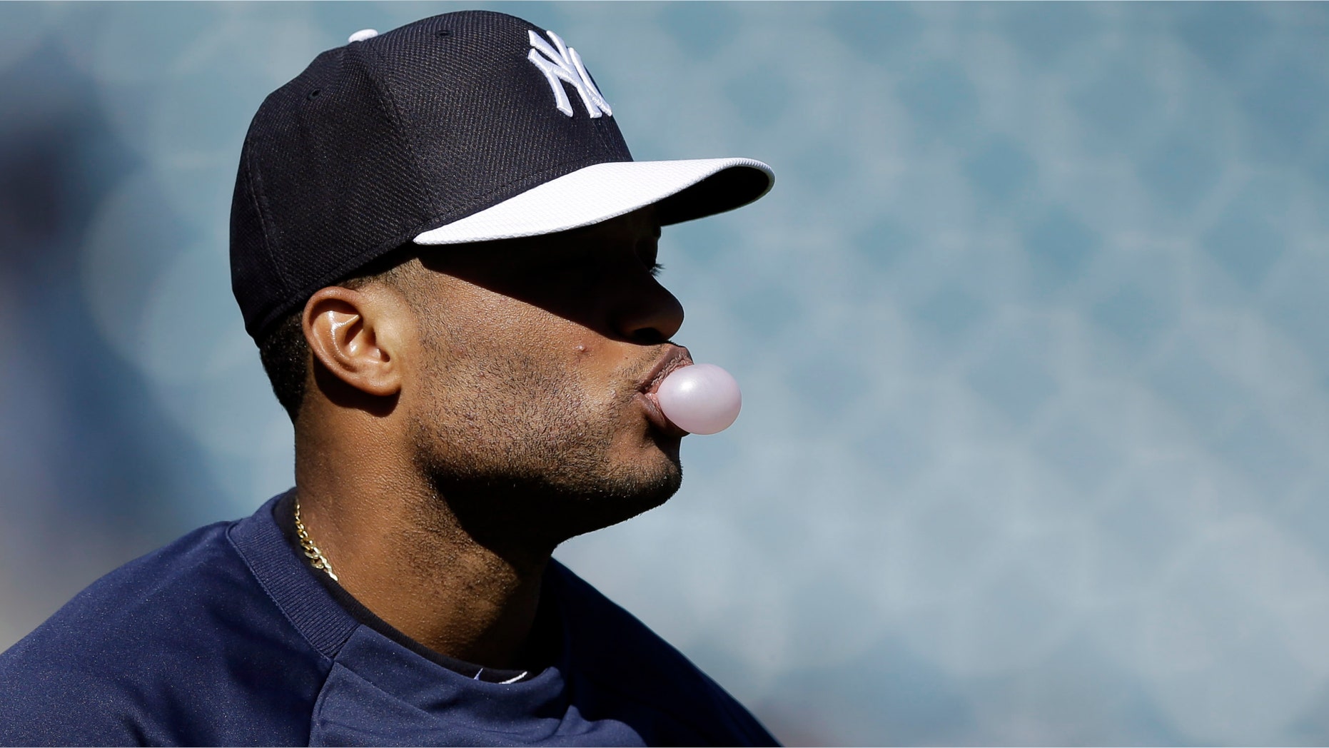 New York Yankees' Robinson Cano blows a bubble during a workout at baseball spring training, Monday, Feb. 18, 2013, in Tampa. (AP Photo/Matt Slocum)