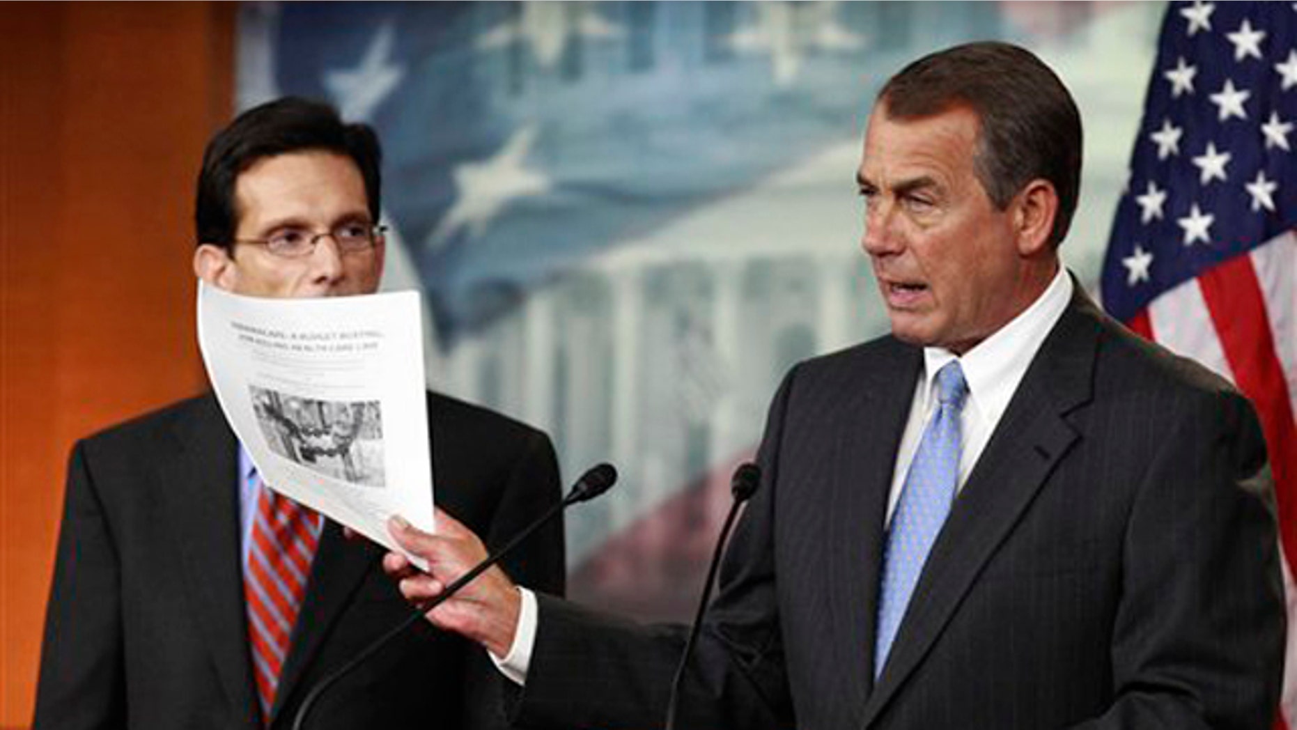In this Jan. 6 file photo, House Speaker John Boehner, right, accompanied by House Majority Leader Eric Cantor, holds a copy of a proposal to repeal the health care law.