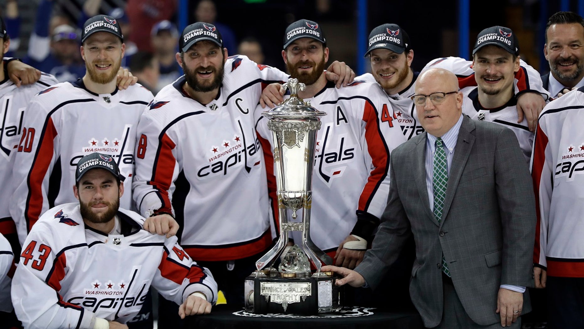The Washington Capitals pose with the NHL's Eastern Conference championship trophy after eliminating Tampa Bay on Wednesday night.