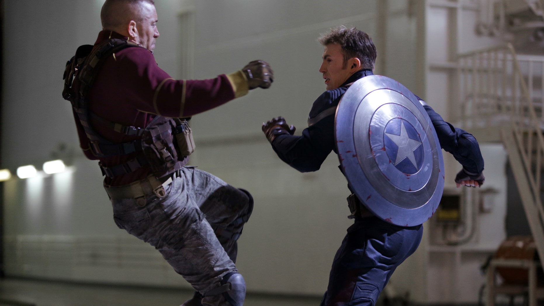 George St-Pierre, left, and Chris Evans in a scene from "Captain America: The Winter Soldier."