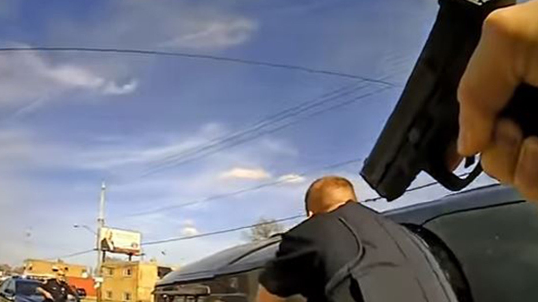 A screen grab depicts the conclusion of a tense incident between police officers and a man in Brooklyn.