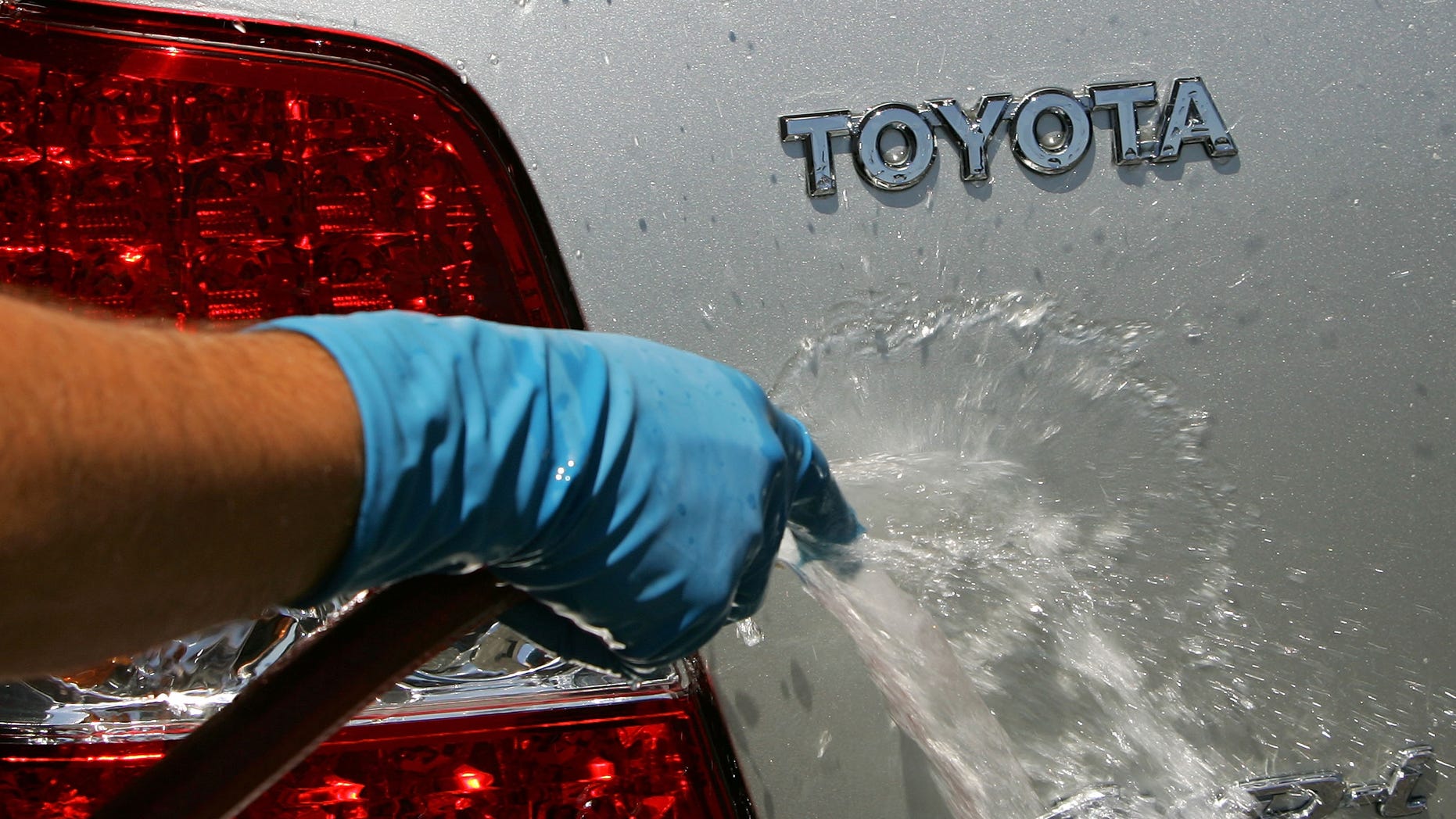 LOS ANGELES - APRIL 24: An employee washes a customer's Toyota at the world's largest auto dealership, Longo Toyota, which enjoys continued strong sales after a record quarterly report for Toyota April 24, 2007 in El Monte, California. Japan-based Toyota has announced that it has overtaken American auto giant General Motors (GM) with worldwide sales reaching 2.35 million cars and trucks in the first quarter of 2007. GM announced its total for the same period was 2.26 million. As Toyota increased sales in every major market, GM gained market share in China but continued to struggle at home and in Europe and has never penetrated far into Japanese market. Toyota's achievement marks another milestone in the long decline of industrial dominance by U.S. car makers. (Photo by David McNew/Getty Images)