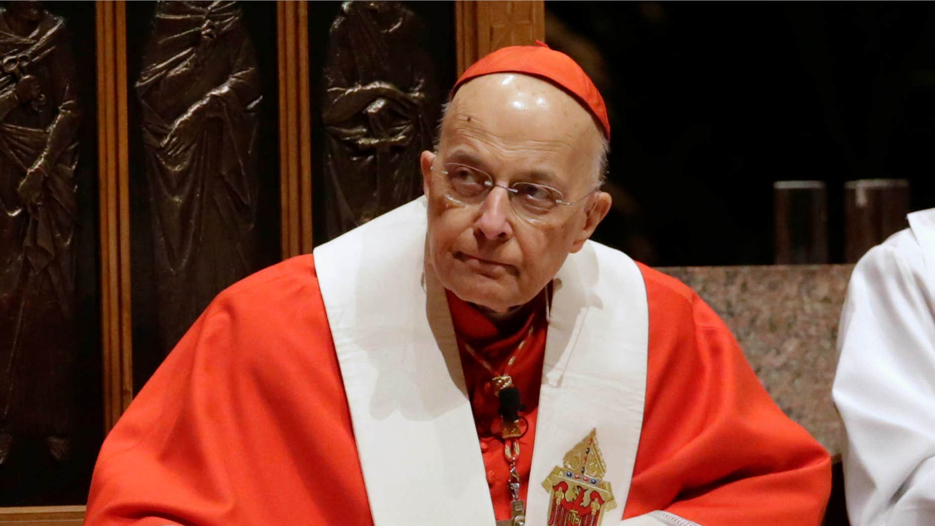 Nov. 17, 2014: Retiring Cardinal Francis George listens at Holy Name Cathedral in Chicago during Bishop Blase Cupich's Rite of Reception service.