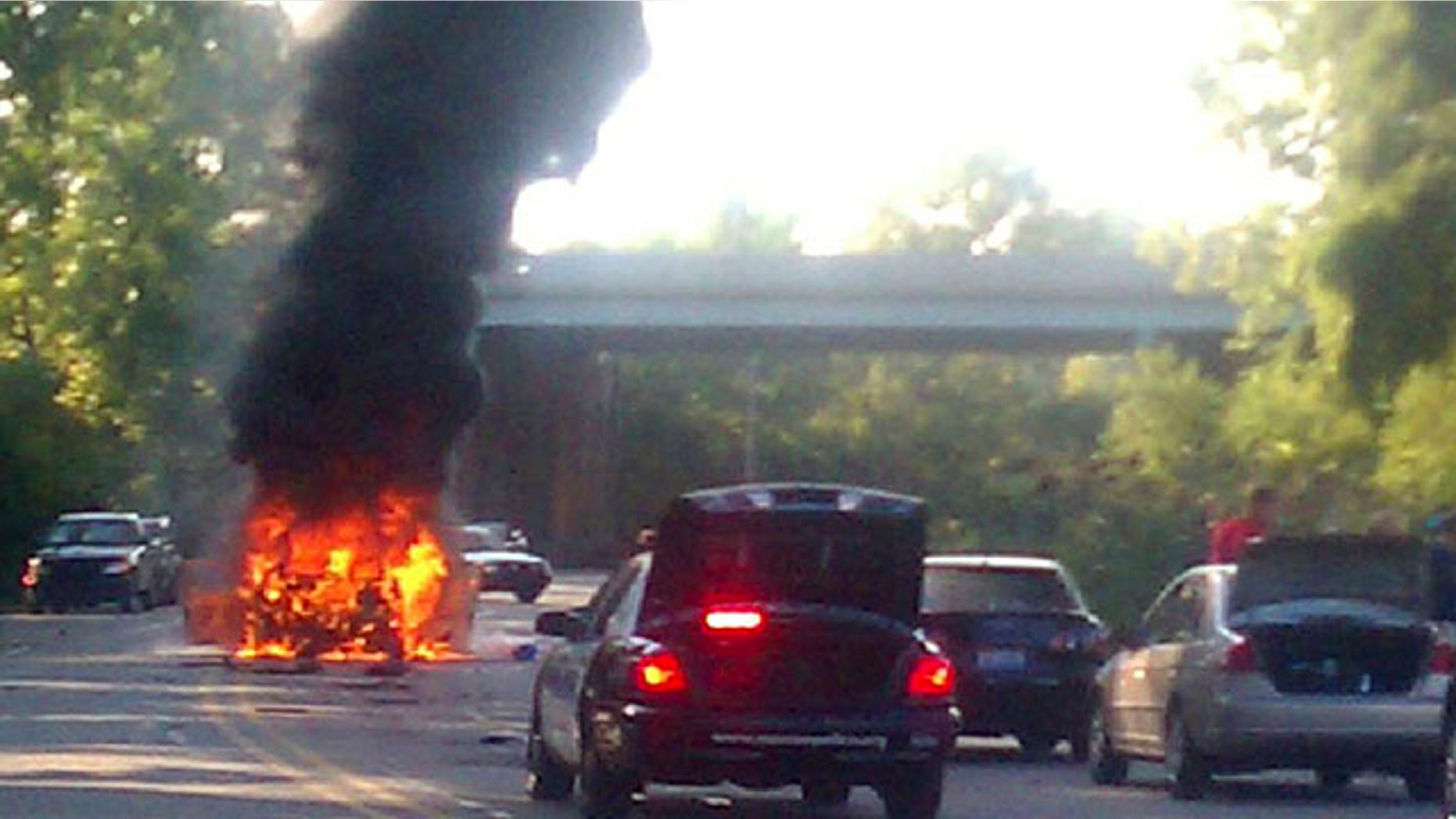Sept. 20: A car burns after it exploded while being driven by a man and his two sons in Monroe, Mich.