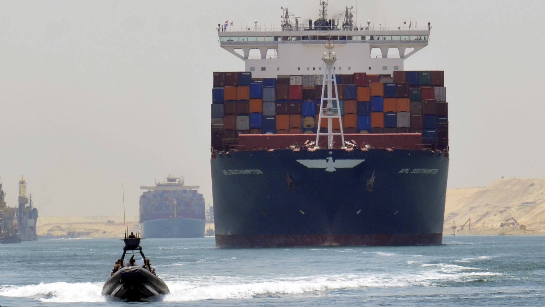 File photo - A cargo ship is seen crossing through the New Suez Canal, Ismailia, Egypt, July 25, 2015. (REUTERS/Stringer)