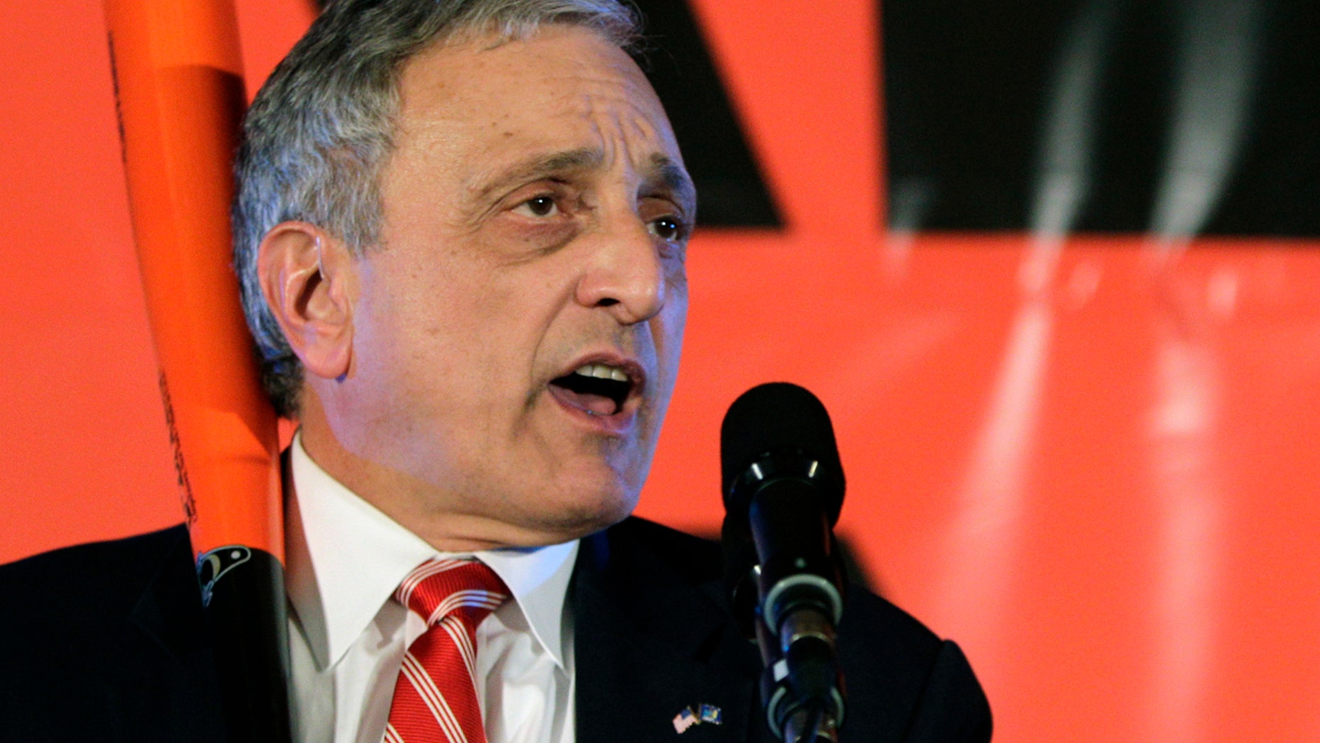 In this Nov. 2, 2010, file photo, Republican gubernatorial candidate Carl Paladino holds a baseball bat as he concedes the election in Buffalo, N.Y.
