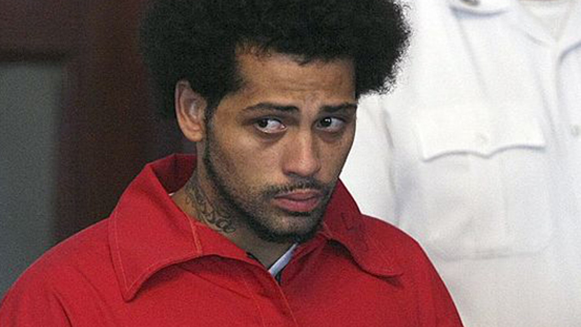 Carlos Ortiz was arraigned on weapons charges on June 28, 2013.