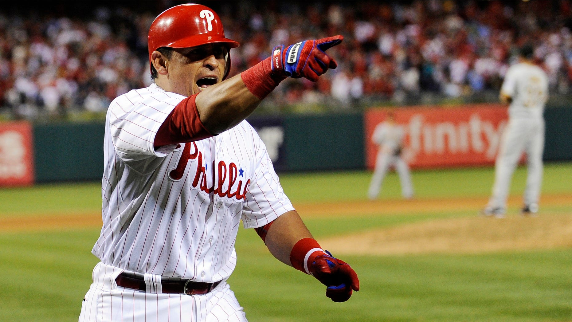 Philadelphia Phillies' Carlos Ruiz points to his team after he hit a home run against the Pittsburgh Pirates in the eighth inning of a baseball game, Tuesday, June 26, 2012, in Philadelphia. The Phillies won 5-4. (AP Photo/Michael Perez)