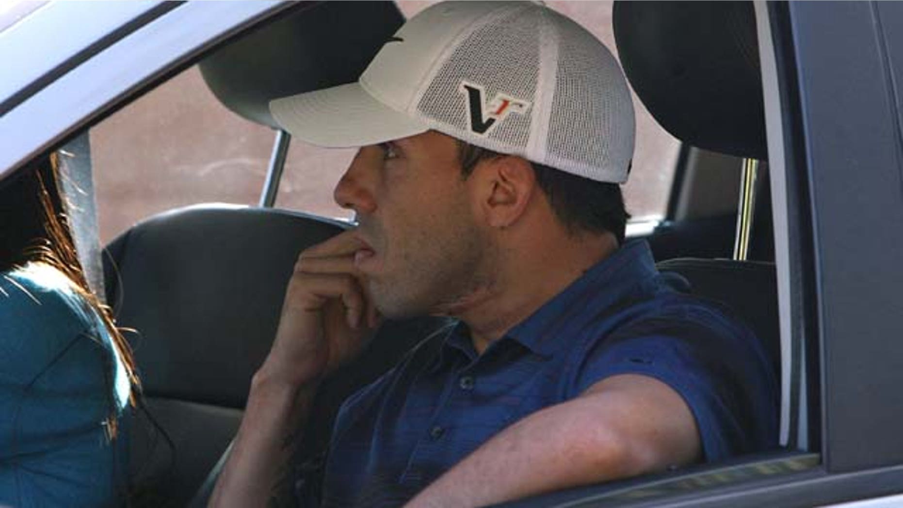 Sept. 28: Manchester City striker Carlos Tevez is driven away from his home in Cheshire, England. (AP Photo/ Dave Thompson/PA Wire)