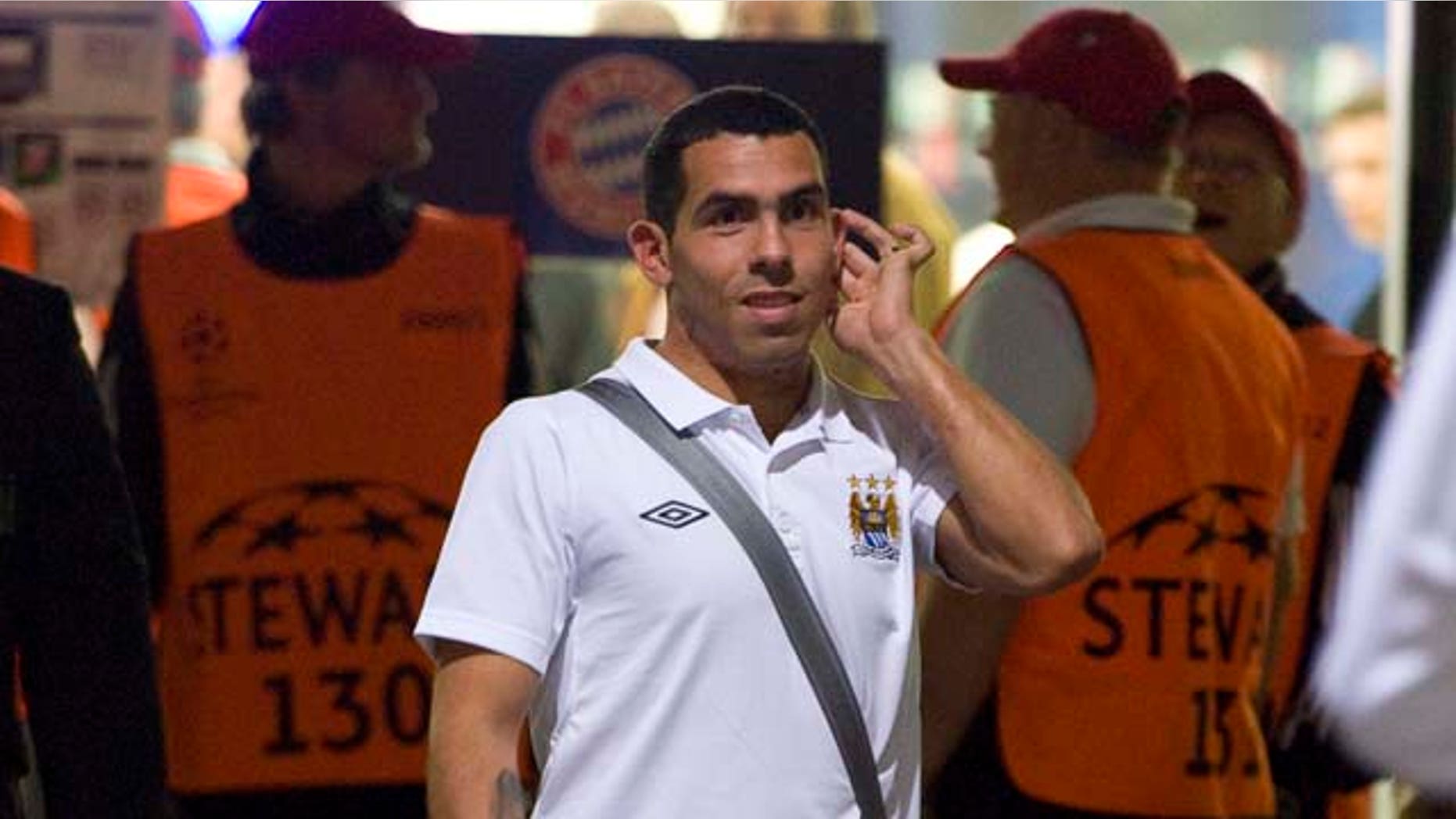 Manchester City's Carlos Tevez leaves the stadium after the Group A Champions League soccer match between FC Bayern Munich and Manchester City FC in Munich, southern Germany, on Tuesday , Sept. 27, 2011. Munich won 2-0. (AP Photo / Kerstin Joensson)