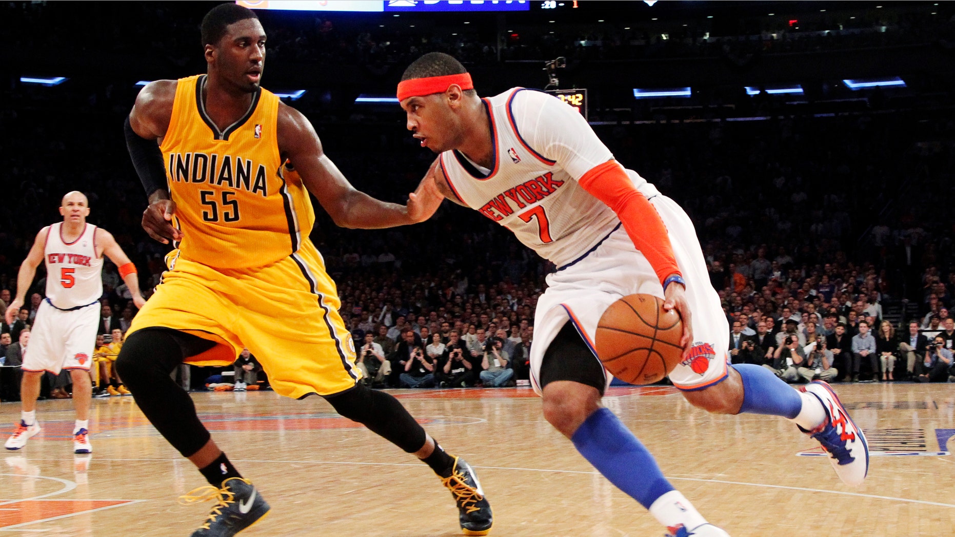 New York Knicks' Carmelo Anthony (7) drives past Indiana Pacers' Roy Hibbert (55) in the second half of Game 2 of their NBA basketball playoff series in the Eastern Conference semifinals at Madison Square Garden in New York, Tuesday, May 7, 2013. The Knicks won 105-79. (AP Photo/Mary Altaffer)
