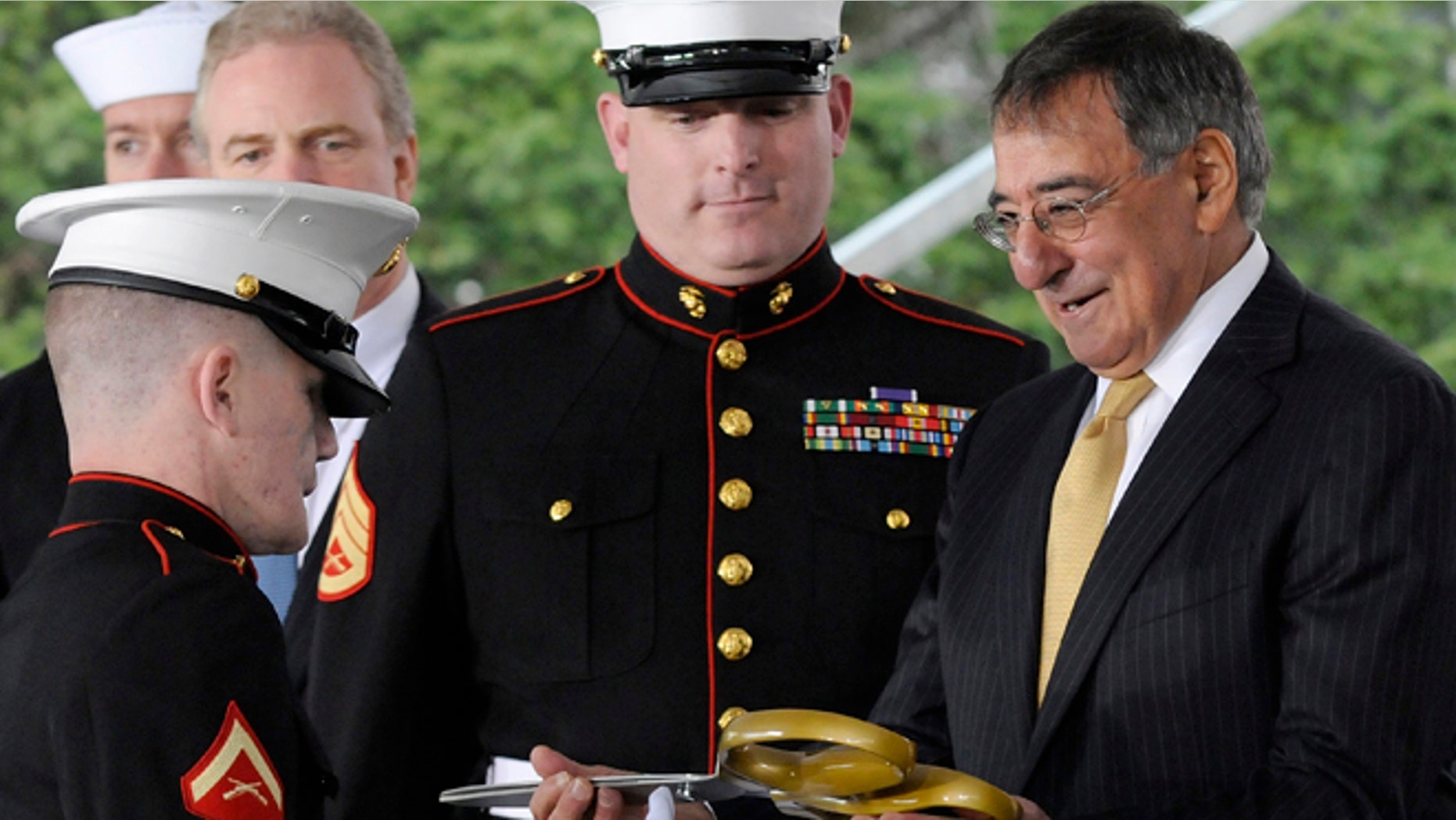 FILE: U.S. Defense Secretary Leon Panetta, right, handles the ceremonial scissors from U.S Marine Corps Lance Corporal Kyle Carpenter to cut the ribbon at the dedication ceremony at the Walter Reed National Military Medical Center in Bethesda.