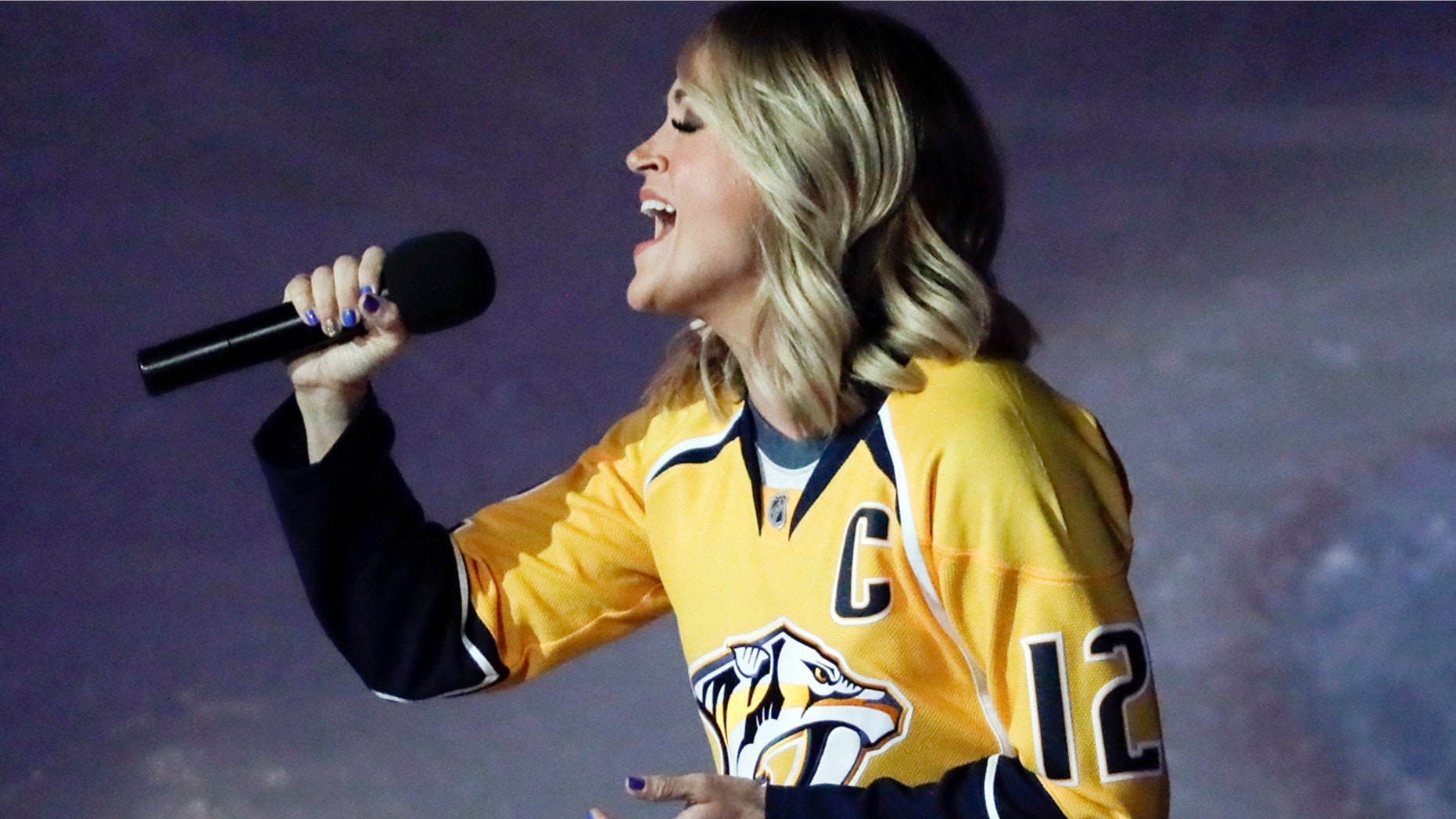 Carrie Underwood performs the national anthem before Game 3 of a first-round NHL hockey playoff series between the Predators and the Chicago Blackhawks Monday, April 17, 2017, in Nashville, Tenn.