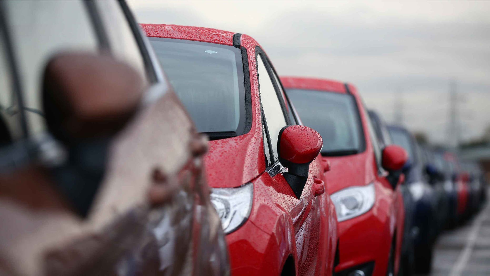 DAGENHAM, ENGLAND - JANUARY 13: Cars are prepared for distribution at a Ford factory on January 13, 2015 in Dagenham, England. Originally opened in 1931, the Ford factory has unveiled a state of the art GBP475 million production line that will start manufacturing the new low-emission, Ford diesel engines from this November this will generate more than 300 new jobs, Ford currently employs around 3000 at the plant in Dagenham. (Photo by Carl Court/Getty Images)