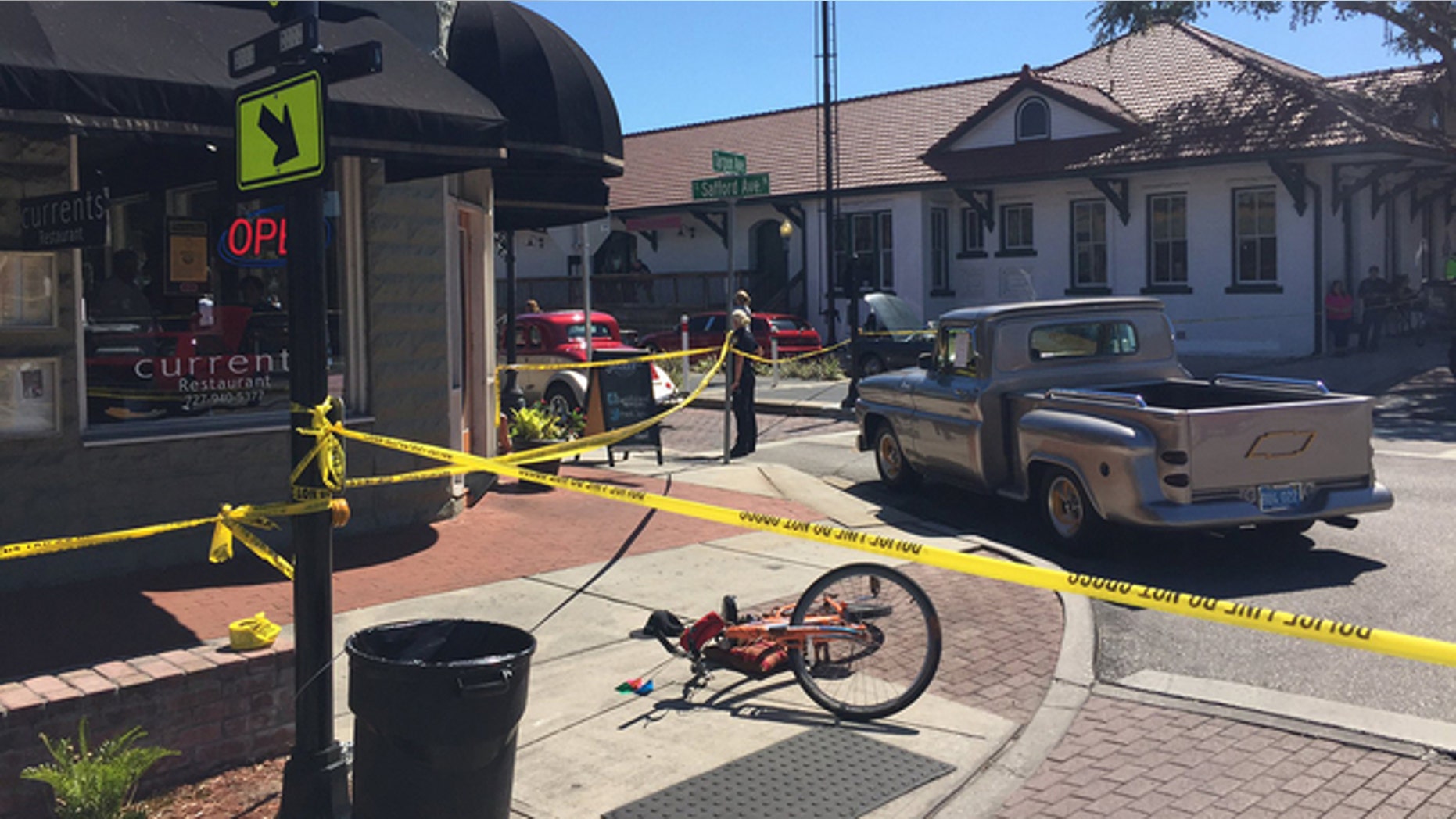 An officer working off-duty for a charity car show shot and killed a man he says came at him with a knife.