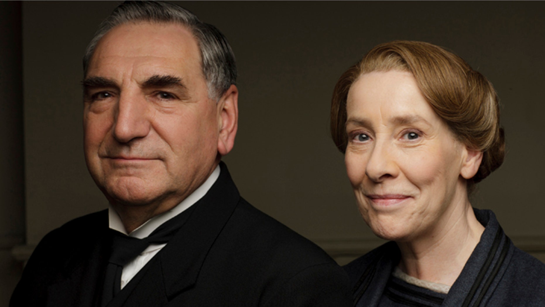 Jim Carter, left, as Mr Carson and Phyllis Logan as Mrs Hughes from series six of "Downton Abbey."
