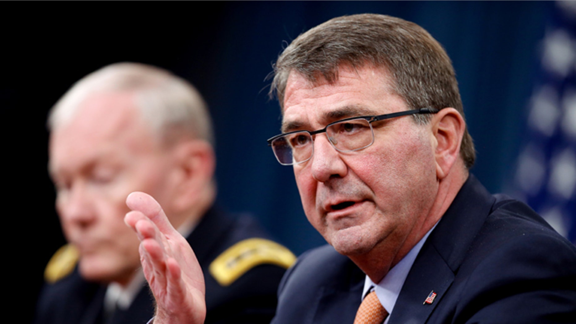 April 16, 2015: Defense Secretary Ash Carter, right, accompanied by Joint Chiefs Chairman Gen. Martin Dempsey, speaks during a news conference at the Pentagon.