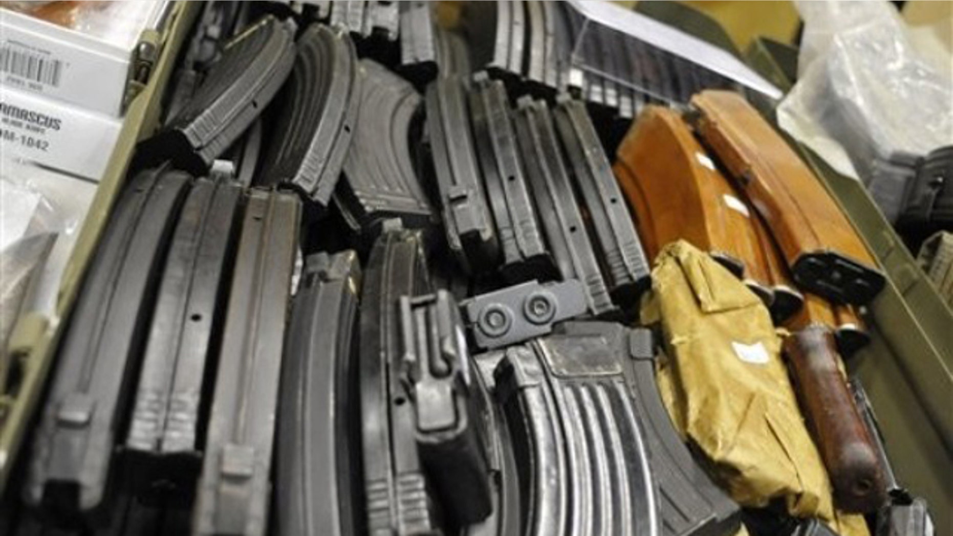 In this June 19, 2010 file photo, AK-47 assault rifle cartridges fill a box at a gun and knife show in White Plains, N.Y.