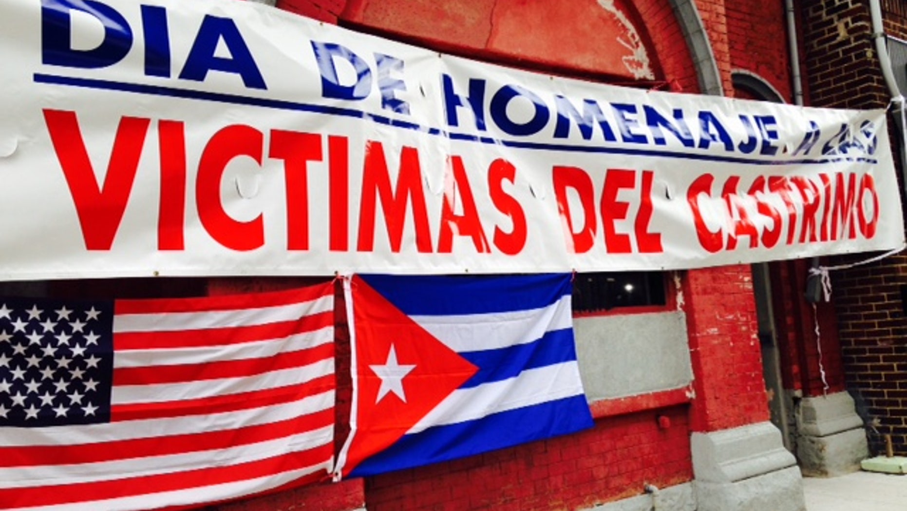 Banner outside Union City headquarters of Former Cuban Political Prisoners says: "Day of Homage to Castro's Victims."