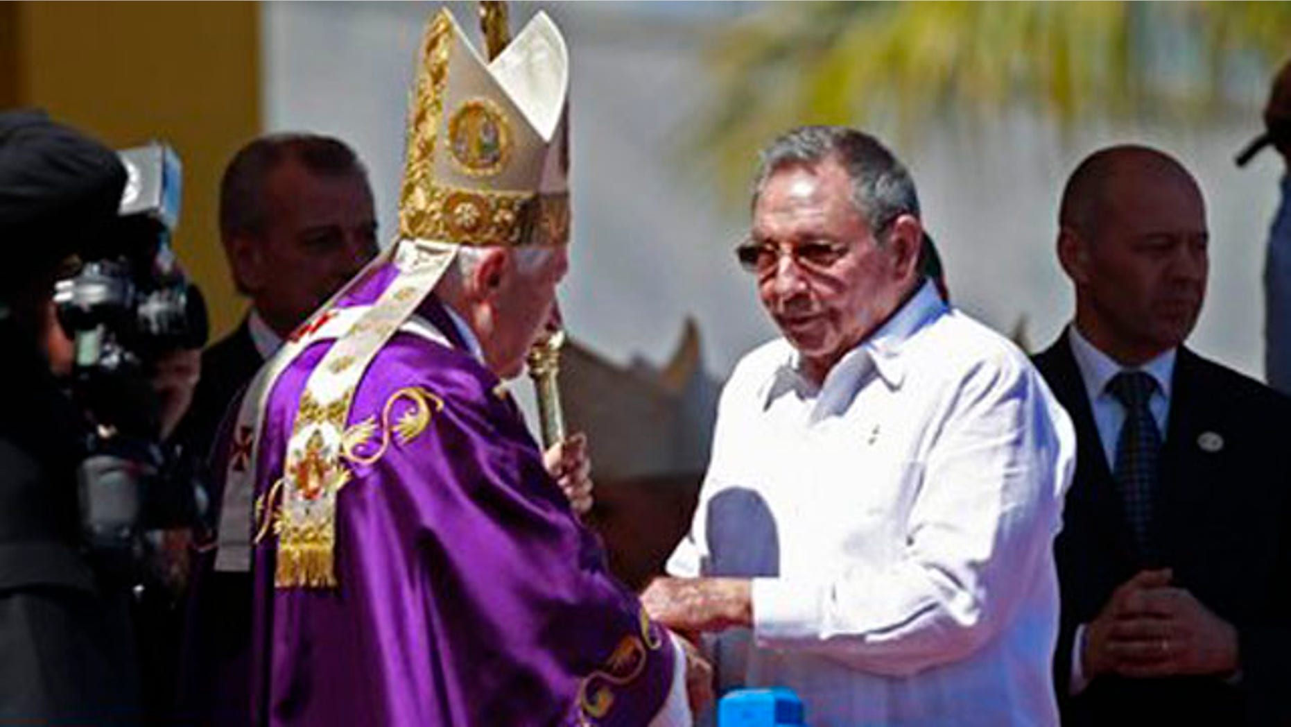 March 28, 2012: Cuba's President Raul Castro greets Pope Benedict XVI at the end of an open-air Mass at Revolution Square in Havana, Cuba.