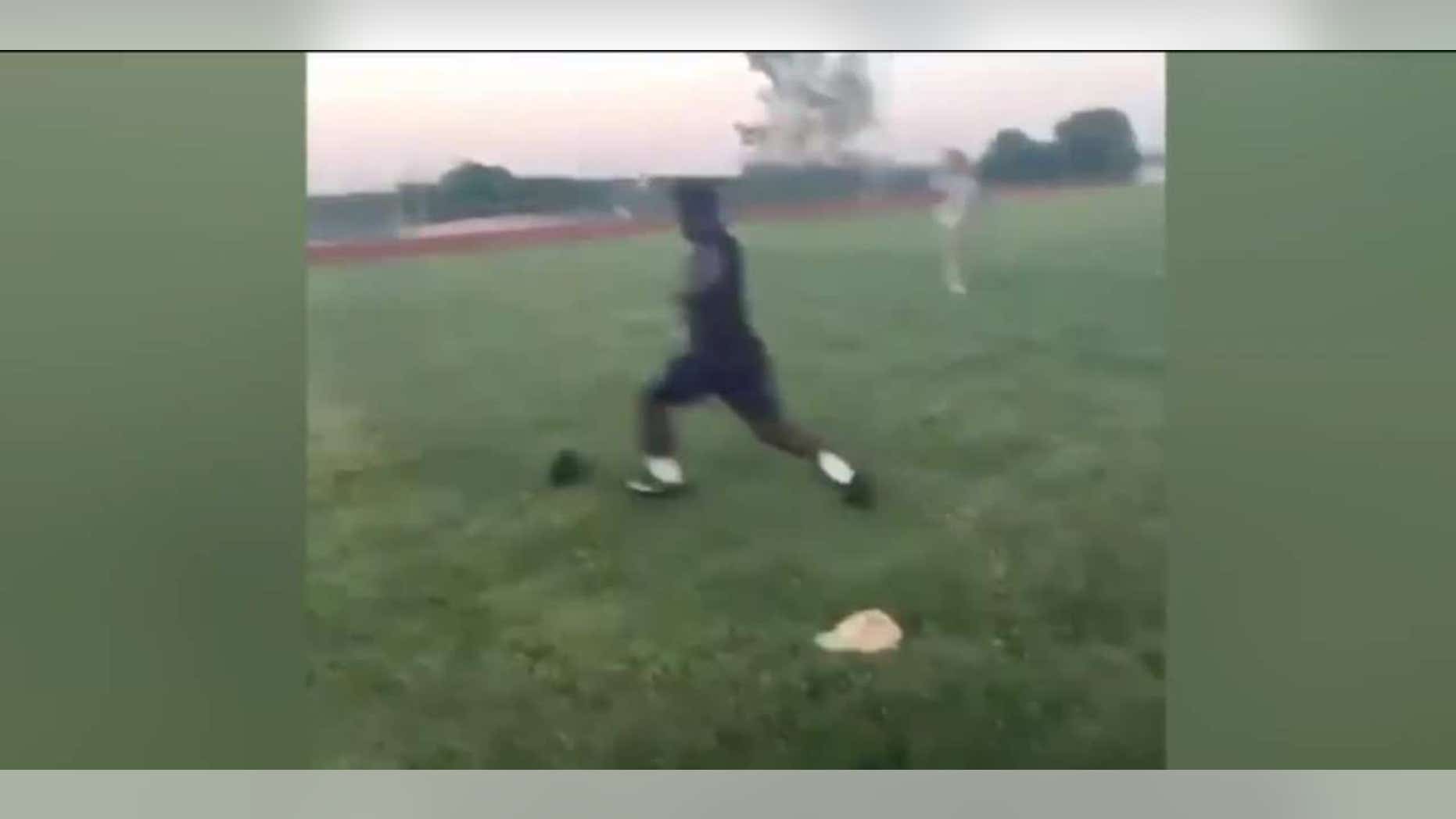 A suspect being sought by Kansas City police is seen about to kick a small cat in a screen capture from a recent online video.