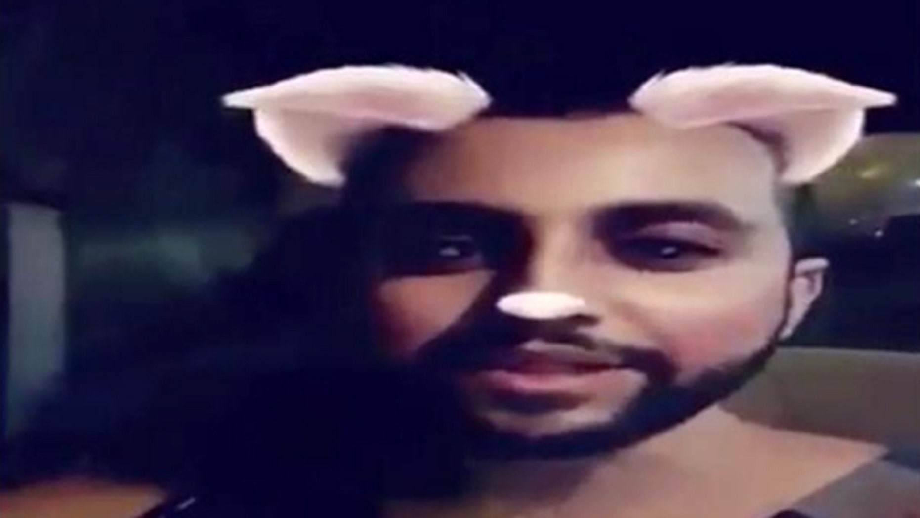 Image from a video showing a man killing at least three cats in Saudi Arabia.