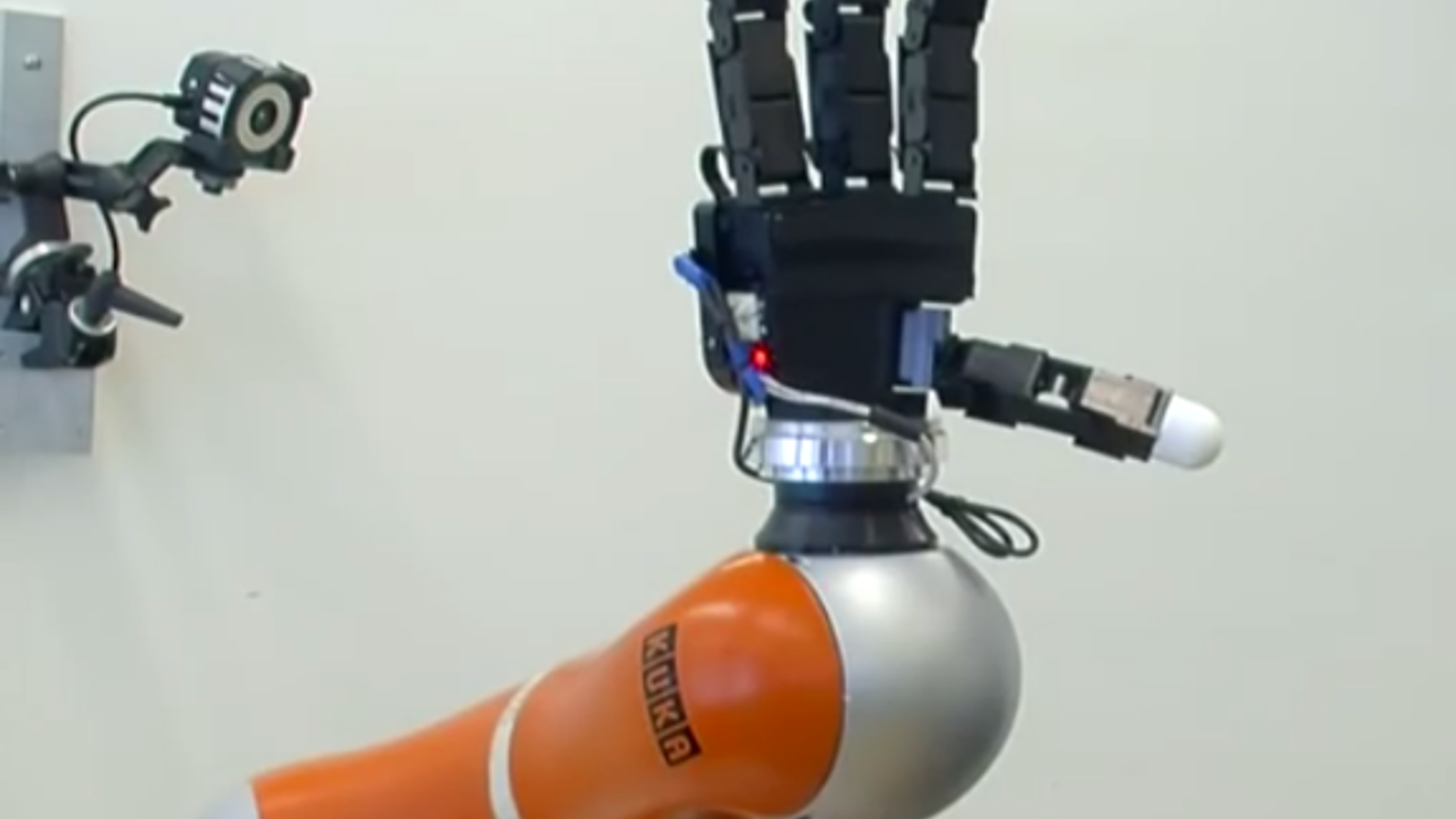 The robot arm can catch objects such as a ball, bottle or tennis racket.