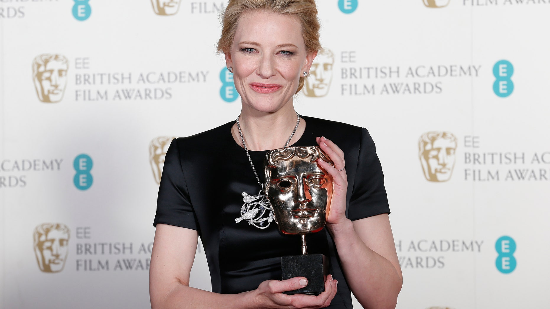 Cate Blanchett celebrates winning Best Actress for "Blue Jasmine" at the British Academy of Film and Arts (BAFTA) awards ceremony at the Royal Opera House in London February 16, 2014. REUTERS/Suzanne Plunkett (BRITAIN - Tags: ENTERTAINMENT) - RTX18YKA