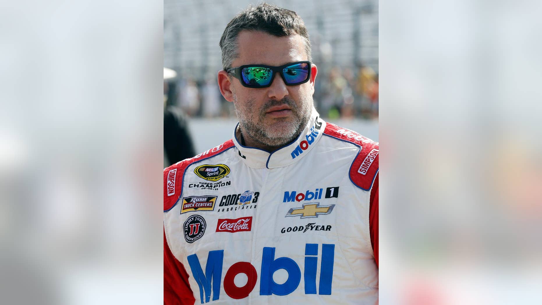 In this photo taken Friday July 15, 2016 Tony Stewart is seen before qualifying at New Hampshire Motor Speedway for Sunday's New Hampshire 301 auto race in Loudon, N.H. Stewart finished Sunday's race second and strengthened his spot inside the top 30 in the points standings. (AP Photo/Jim Cole)