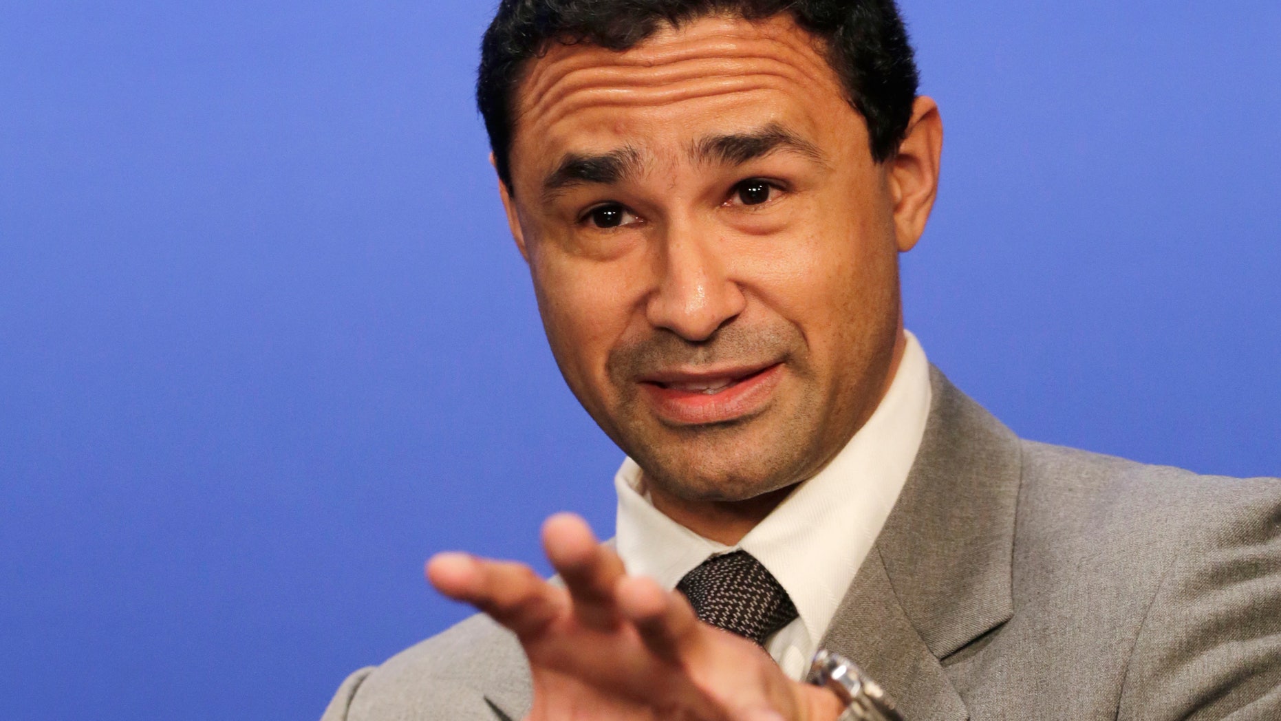 In this Oct. 28, 2013 photo, psychic Jesse Bravo talks during an interview in New York. Bravo decries seers who make what he sees as impossible promises or who press clients to consult, and pay, them frequently. "There are a lot of predators out there," he says. (AP Photo/Mark Lennihan)