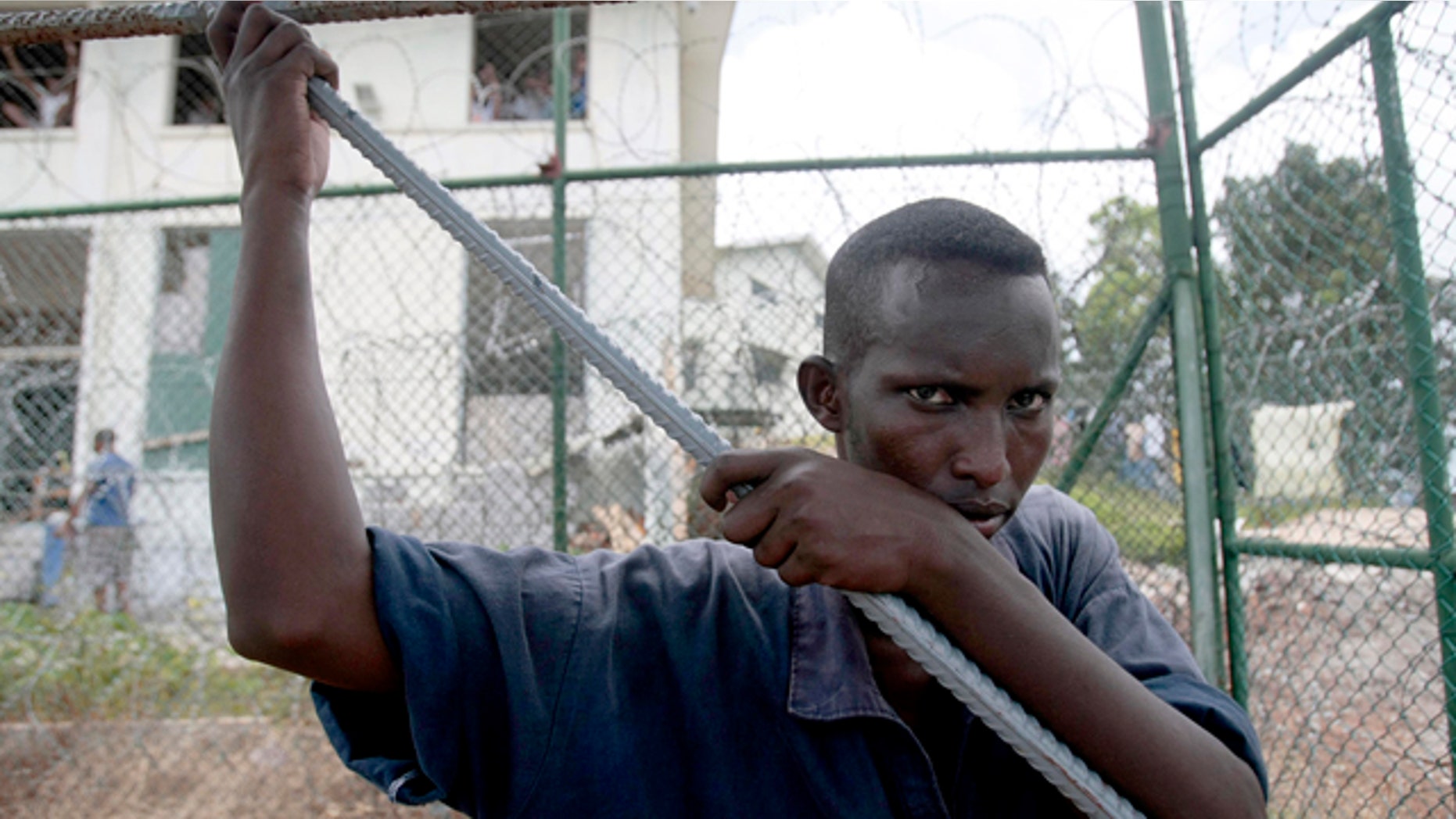 A Somali inmate detained last year during an anti-piracy operation conducted by Seychelles Coast Guard pauses as he works at the incarceration block in Montagne Posee near Victoria, Seychelles. Piracy attacks worldwide reached an all-time high in 2011, becoming more violent and lucrative than ever in the process. (AP)