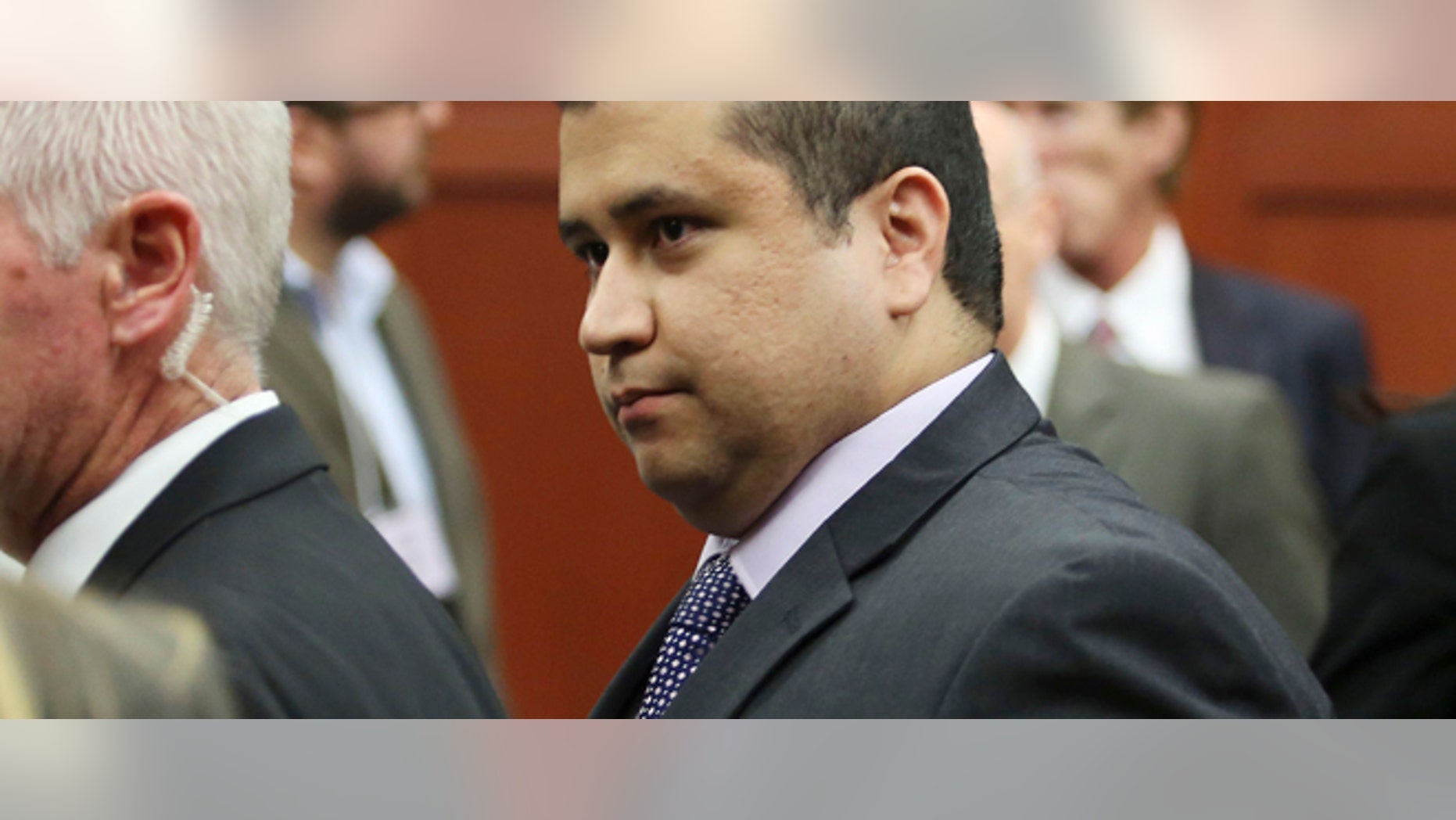 George Zimmerman leaves court with his family after Zimmerman's not guilty verdict was read in Seminole Circuit Court in Sanford, Fla. on Saturday, July 13, 2013. Jurors found Zimmerman not guilty of second-degree murder in the fatal shooting of 17-year-old Trayvon Martin in Sanford, Fla. (AP Photo/Gary W. Green, Pool)