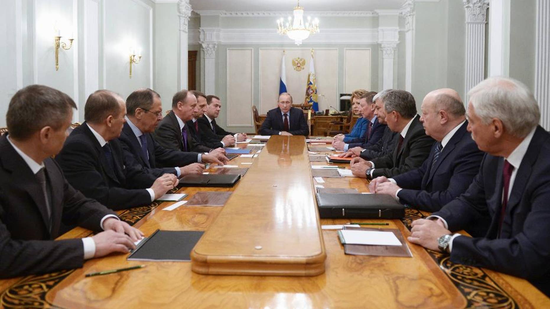 Russian President Vladimir Putin, center, chairs a Security Council meeting in the Novo-Ogaryovo residence outside Moscow, Russia, Friday, Jan. 30, 2015. (AP Photo/RIA-Novosti, Alexei Nikolsky, Presidential Press Service)