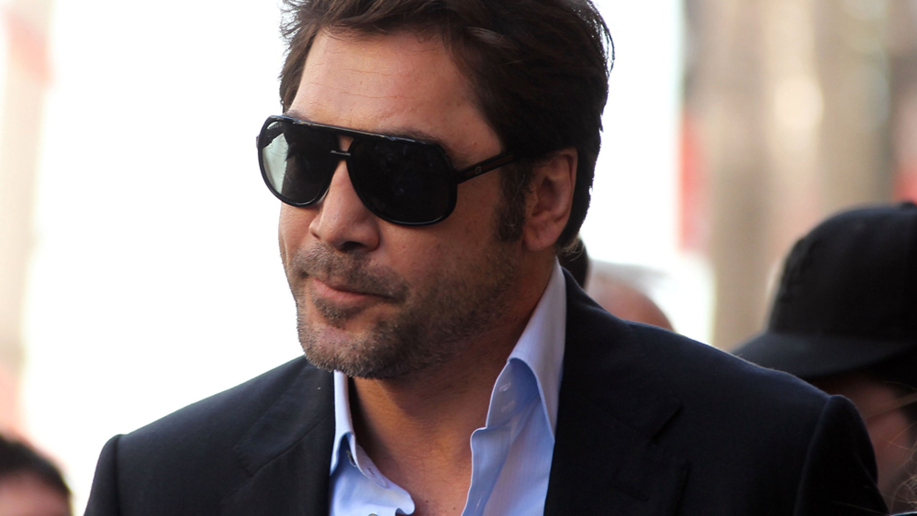 HOLLYWOOD, CA - APRIL 01: Actor Javier Bardem poses for photographers during the installation ceremony for actress Penelope Cruz's star on the Hollywood Walk of Fame on April 1, 2011 in Hollywood, California. (Photo by Frederick M. Brown/Getty Images)