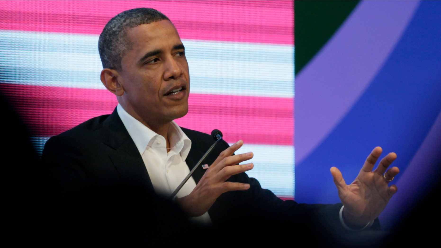 President Barack Obama participates in a three-way conversation with Brazil's President Dilma Rousseff and Colombia's President Juan Manuel Santos, not pictured, at the CEO Summit of the Americas, in Cartagena, Colombia, Saturday April 14, 2012. Regional business leaders are meeting parallel to the sixth Summit of the Americas which brings together presidents and prime ministers from Canada, the Caribbean, Latin America and the U.S. (AP Photo/Carolyn Kaster)