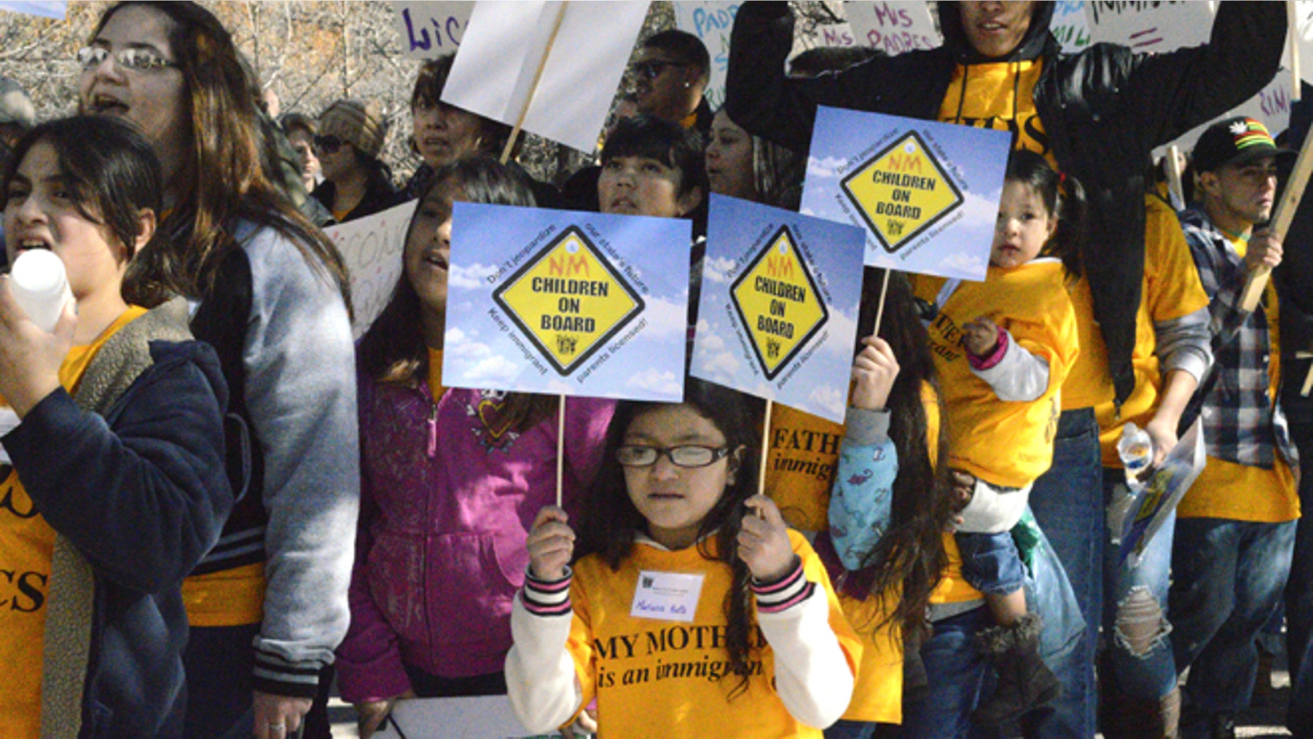 Thousands of immigrant advocates rally at the State Capitol to protest a proposal aimed at repealing a New Mexico law that allows immigrants in the country illegally to obtain driver's licenses Monday, Feb. 2, 2015, in Santa Fe, N.M. (AP Photo/Russell Contreras)