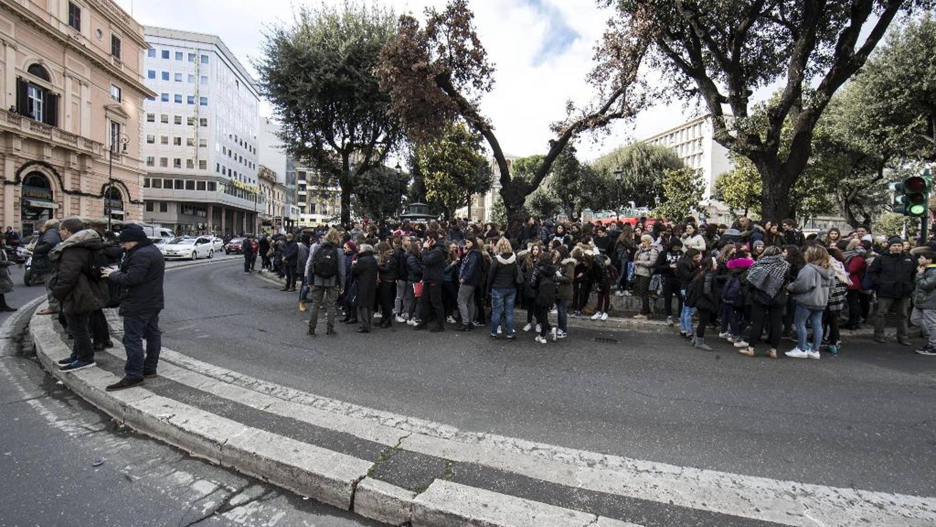 Students and teachers stand outside a highschool after it was evacuated following three earthquakes which hit central Italy in the space of an hour, shaking the same region that suffered a series of deadly quakes last year, in Rome, Wednesday, Jan. 18, 2017. (Massimo Percossi/ANSA via AP)