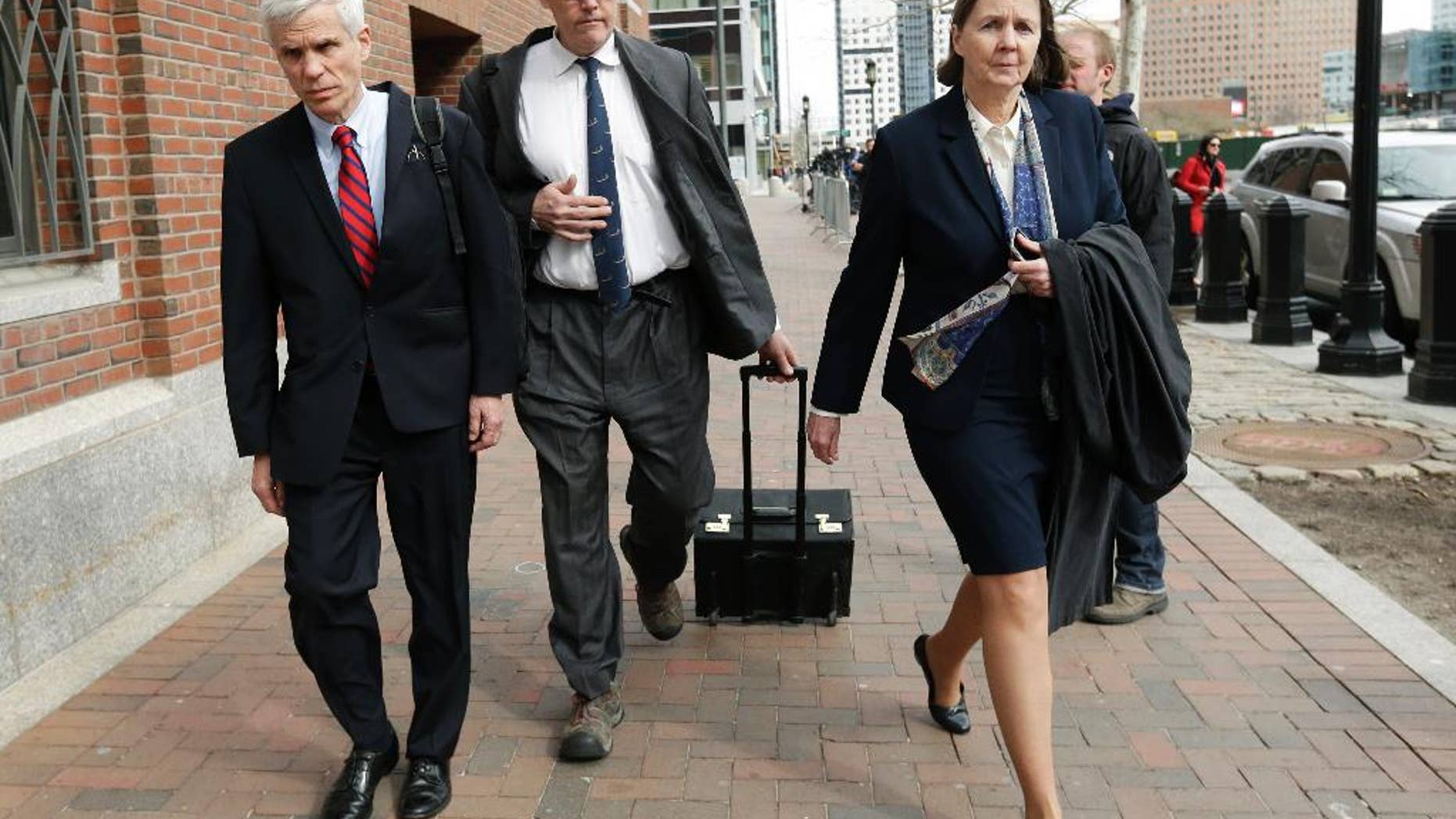 Defense attorneys, from left, David Bruck, Timothy Watkins and Judy Clarke, leave federal court in Boston at the end of the day's session Monday, April 27, 2015, during the penalty phase in the trial of Dzhokhar Tsarnaev. Tsarnaev was convicted of the Boston Marathon bombings that killed three and injured 260 people in April 2013. (AP Photo/Steven Senne)
