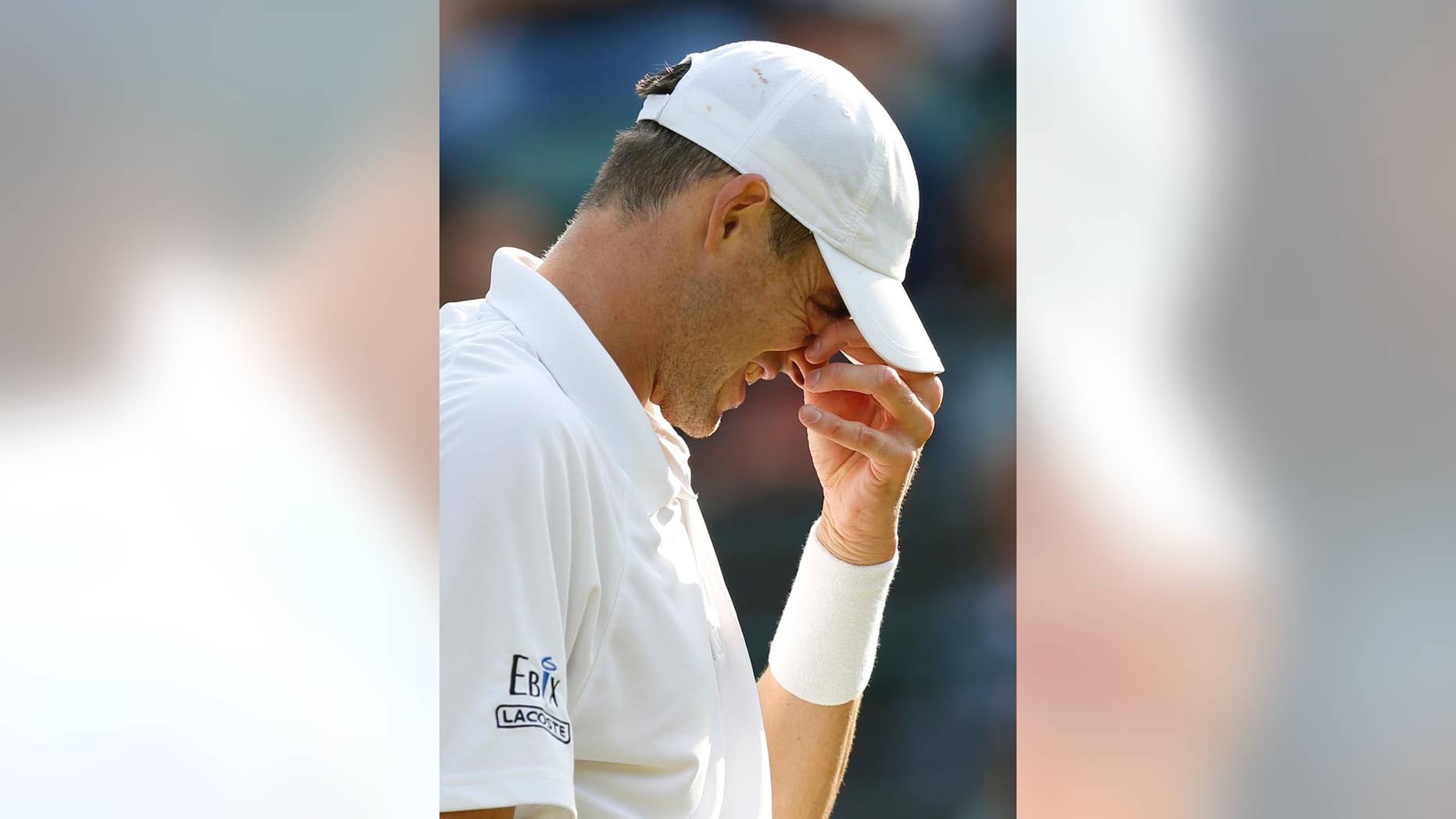 John Isner of the United States reacts as he plays Marin Cilic of Croatia during their singles match at the All England Lawn Tennis Championships in Wimbledon, London, Friday July 3, 2015. (AP Photo/Pavel Golovkin)