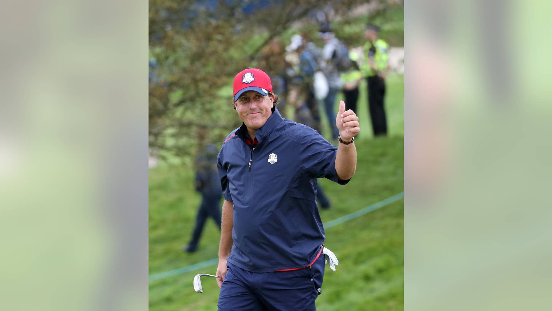 Phil Mickelson of the US gestures as he walks to the 7th green during a practice round ahead of the Ryder Cup golf tournament at Gleneagles, Scotland, Tuesday, Sept. 23, 2014. (AP Photo/Scott Heppell)
