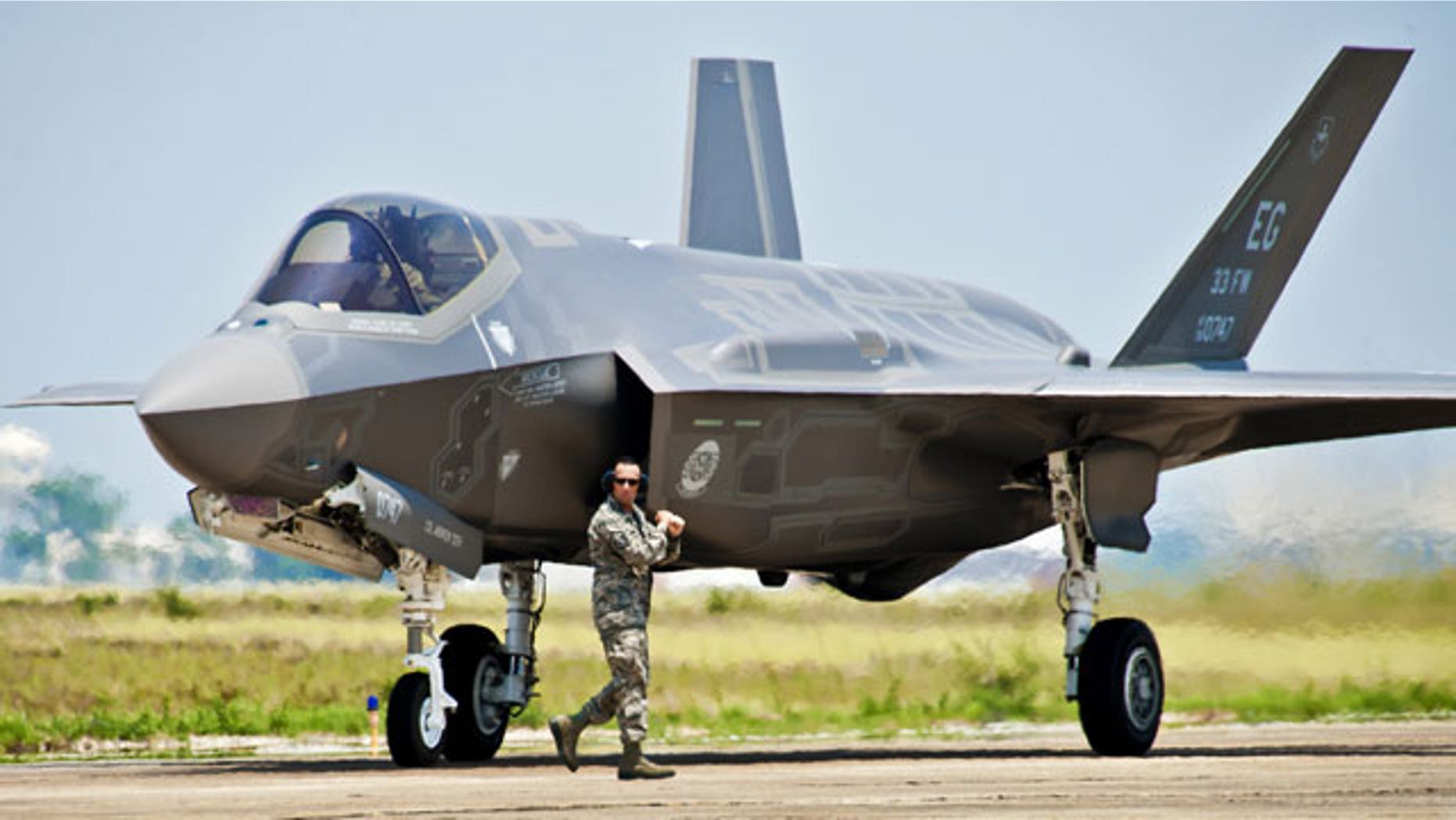 FILE: A 33rd Fighter Wing aircraft maintainer moves by the Department of Defense's newest aircraft, the U.S. Air Force F-35 Lightning II joint strike fighter (JSF), before giving the pilot an order to taxi the aircraft at Eglin Air Force Base, Fla.