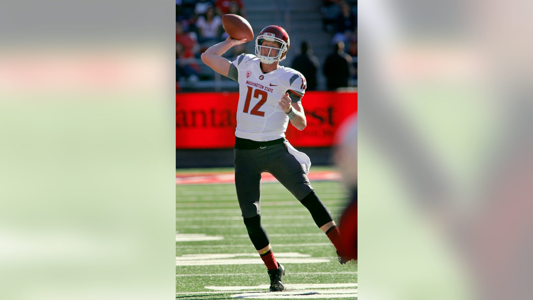 Washington State's quarterback Connor Halliday throws against Arizona in the second half of an NCAA college football game on Saturday, Nov. 16, 2013, in Tucson, Ariz. Washington State won 24 - 17. (AP Photo/John MIller)
