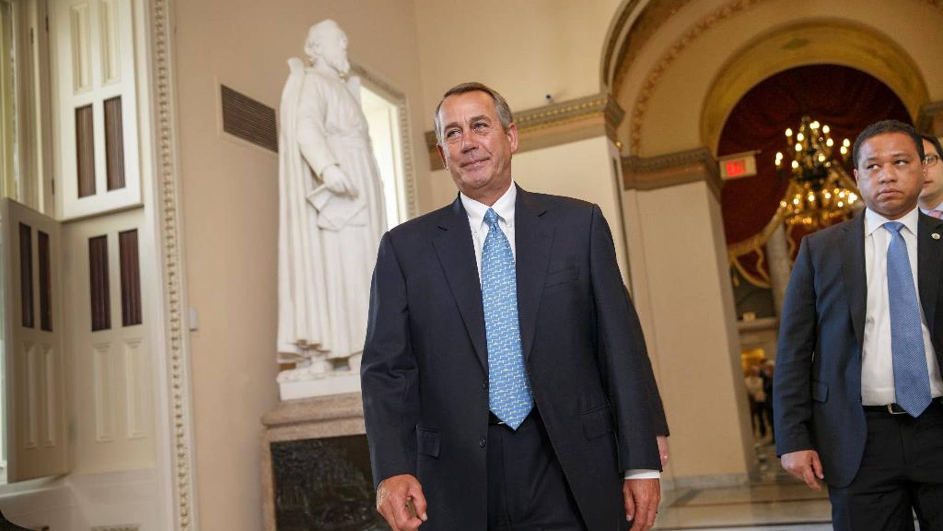 House Speaker John Boehner of Ohio walks to the House chamber on Capitol Hill in Washington, Friday, Feb. 27, 2015, for a procedural vote as Congress moves toward a spending bill for the Homeland Security Department hours before a shutdown was to begin. (AP Photo/J. Scott Applewhite)