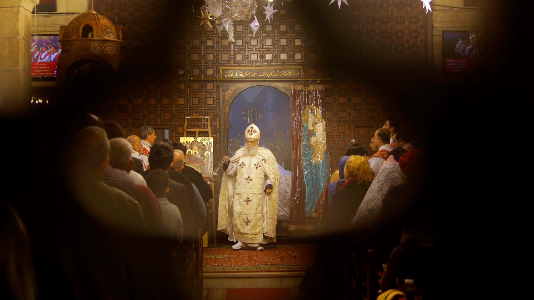 FILE -- Jan. 6: Bishop Aclimandos leads Coptic Christmas Eve mass at the Virgin Mary church in Cairo, Egypt. Egypt's Coptic Christians, who make up about 10 percent of the country's 90 million people, are the largest Christian community in the Middle East.