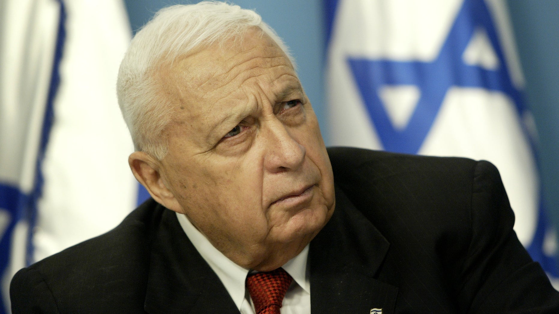FILE -- In this Sunday May 16, 2004 file photo, Israeli Prime Minister Ariel Sharon pauses during a news conference in his Jerusalem office regarding education reform. On Wednesday, Jan. 1, 2014 the condition of the comatose former Israeli Prime Minister Ariel Sharon has taken a turn for the worse, the hospital treating him said Wednesday. Sharon, 85, has been in a coma since 2006 when a devastating stroke incapacitated him at the height of his political power. (AP Photo/Oded Balilty, File)