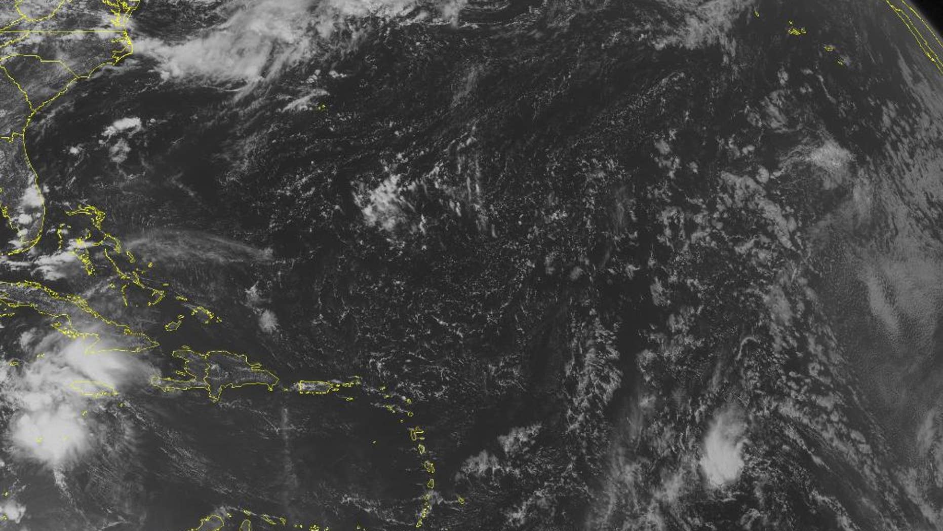 This NOAA satellite image taken Tuesday, Aug. 2, 2016 at 12:45 PM EDT shows Tropical Storm Earl 210 miles south of Grand Cayman.