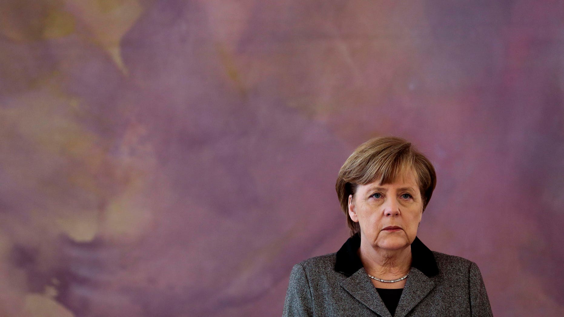 Chancellor Angela Merkel attends the lay-off and appointment ceremony for outgoing Agriculture Minister Hans-Peter Friedrich and his successor Christian Schmidt at Bellevue Palace in Berlin, Germany, Tuesday, May 22, 2012. Friedrich resigned after it emerged that he tipped off another senior politician about an investigation involving a prominent lawmaker. The criticism involved Friedrich’s previous role as interior minister: he has acknowledged telling the leader of Germany’s center-left Social Democrats last October that lawmaker Sebastian Edathy’s name had come up in an investigation. Hannover prosecutors say the case involves alleged ordering of pictures of underage boys, though it's unclear whether they legally constitute child porn. Edathy denies ordering or possessing child porn. (AP Photo/Markus Schreiber)