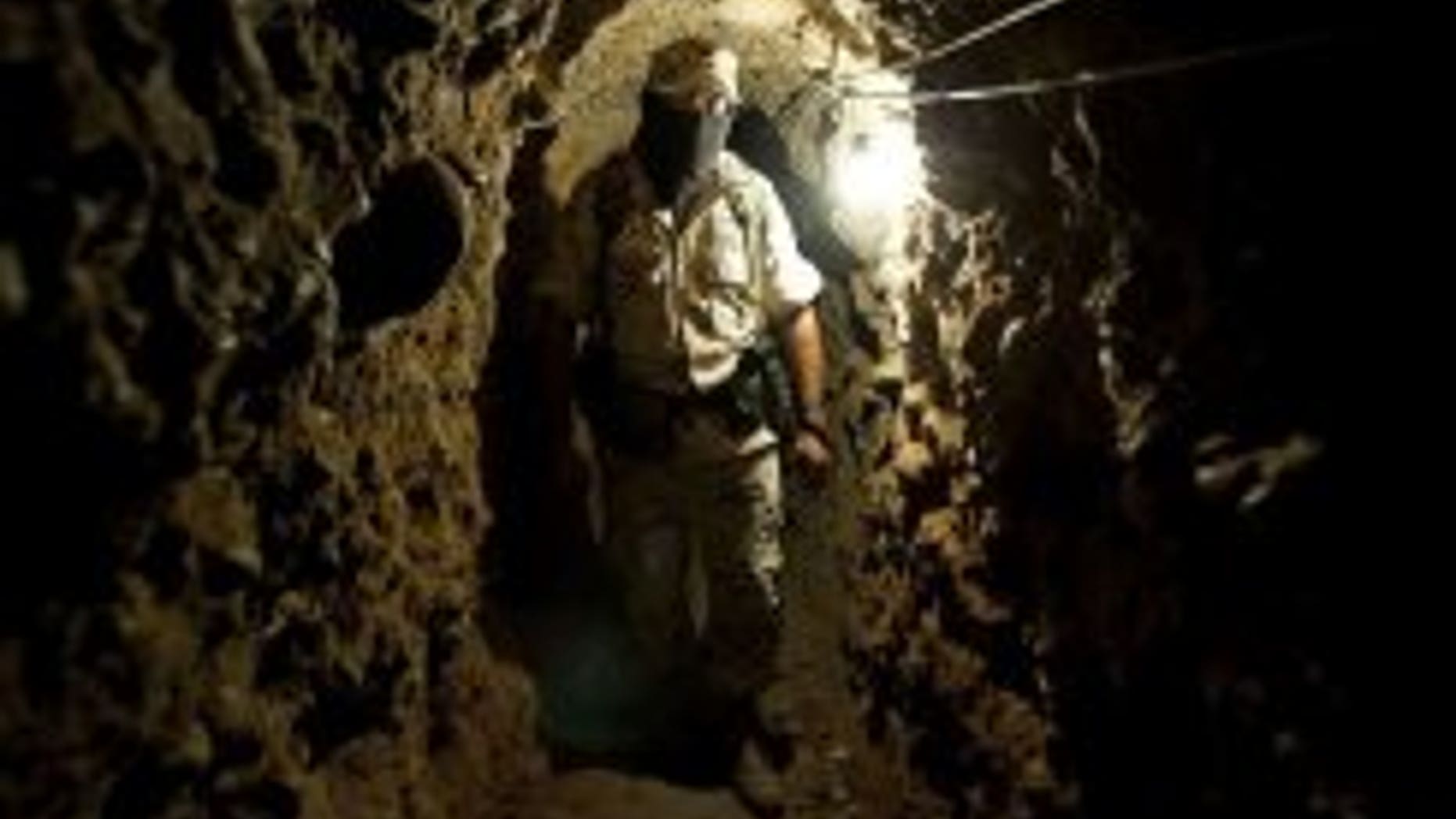 A soldier of the Mexican Army walks along a trans-border tunnel found near Tijuana Airport, in Tijuana, in the Mexican border with San Diego in the US, on August 11.