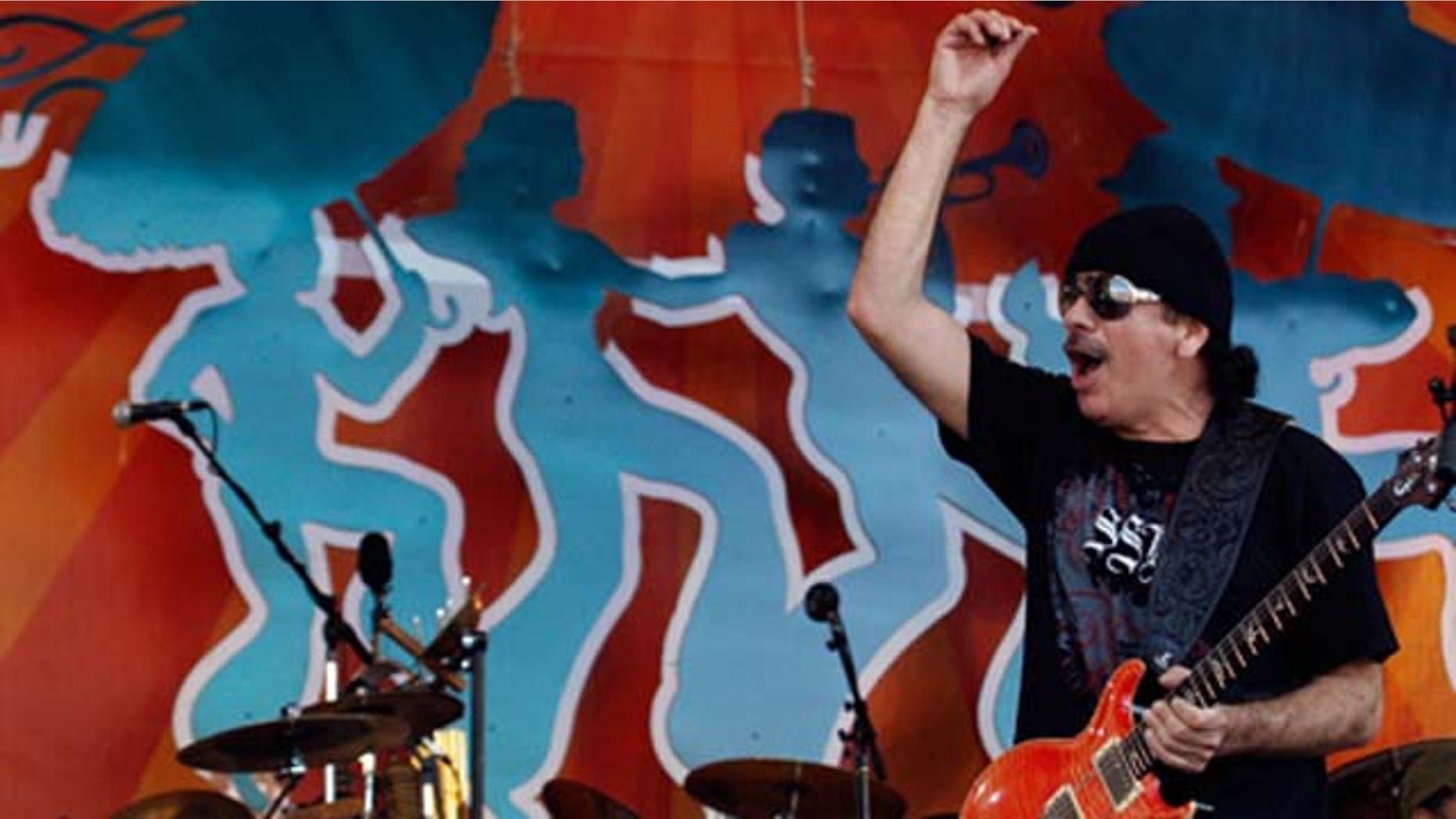 May 04, 2008: Carlos Santana performs during the New Orleans Jazz and Heritage Festival at the Fair Grounds Race Course in New Orleans, LA.